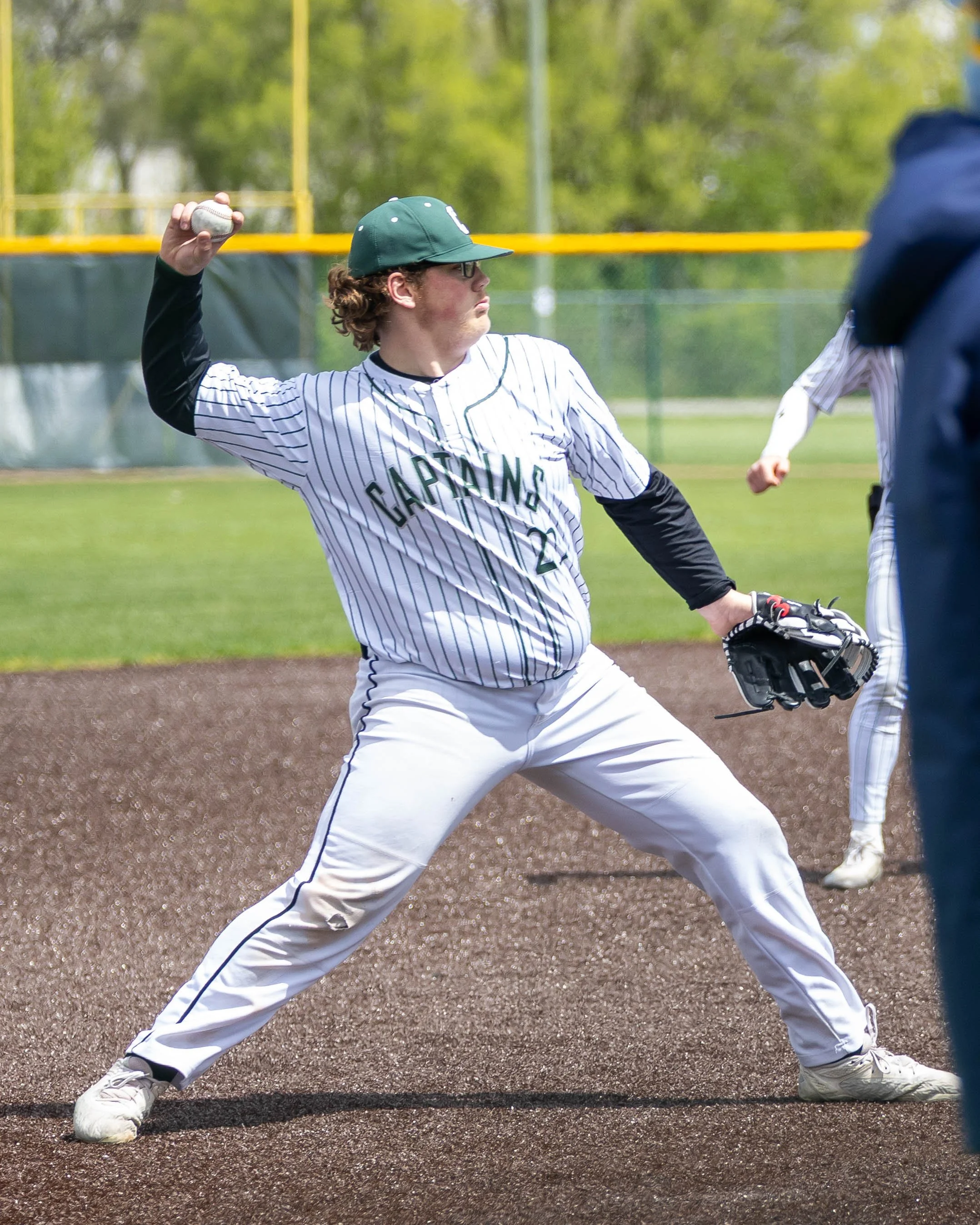Kettering #23 throws to 1st base