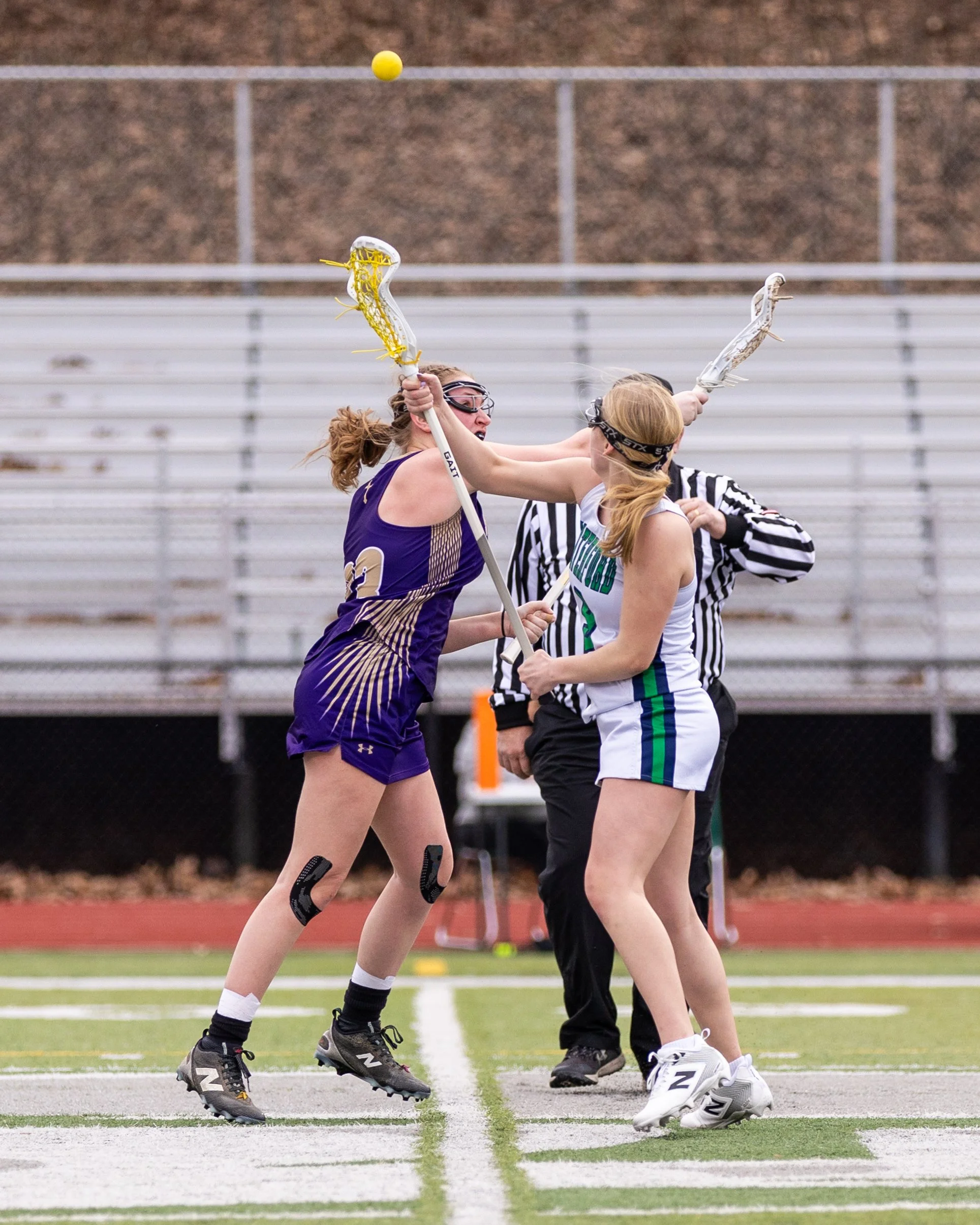 #9 faces off with the ball in the air 