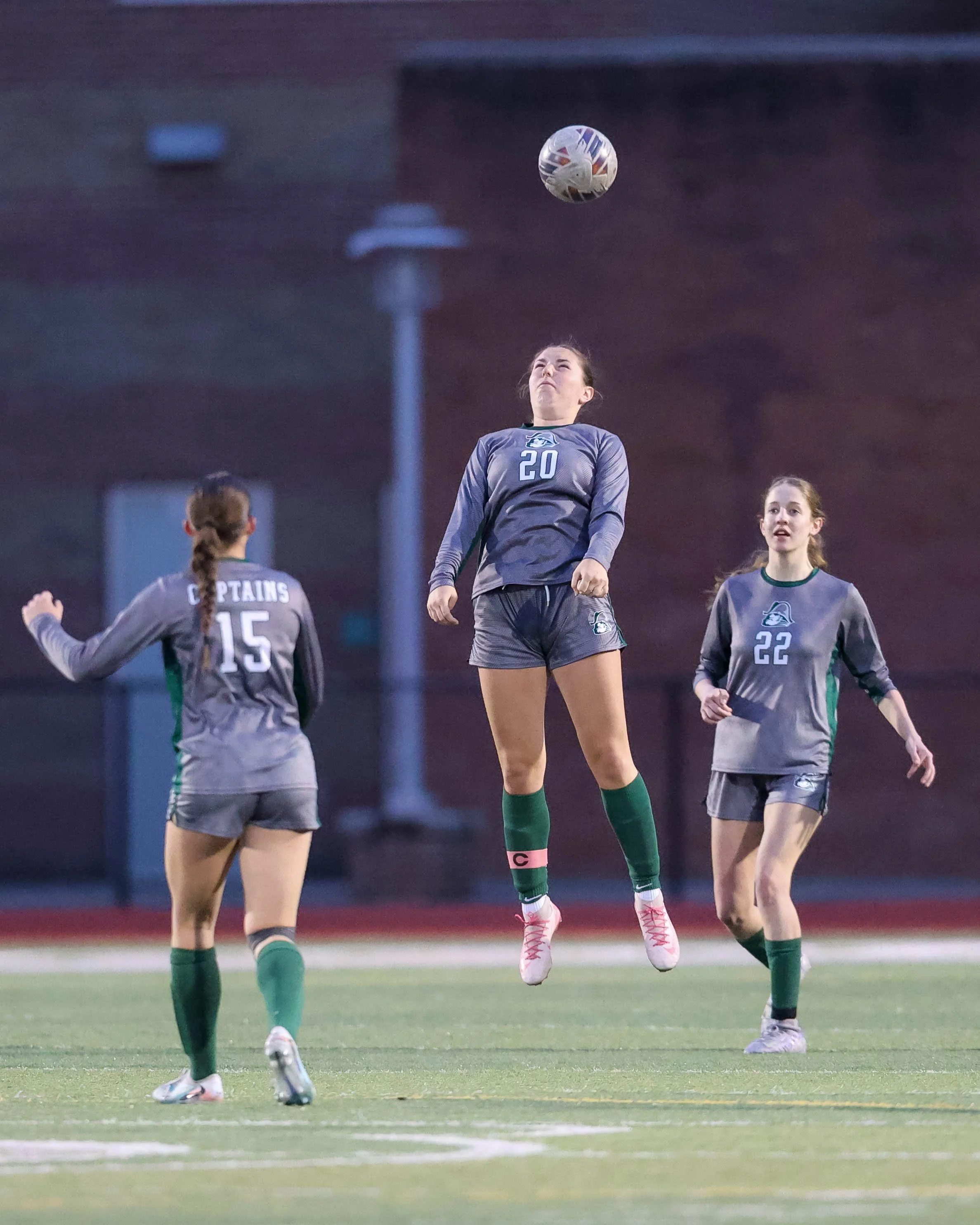 #20 heads the ball