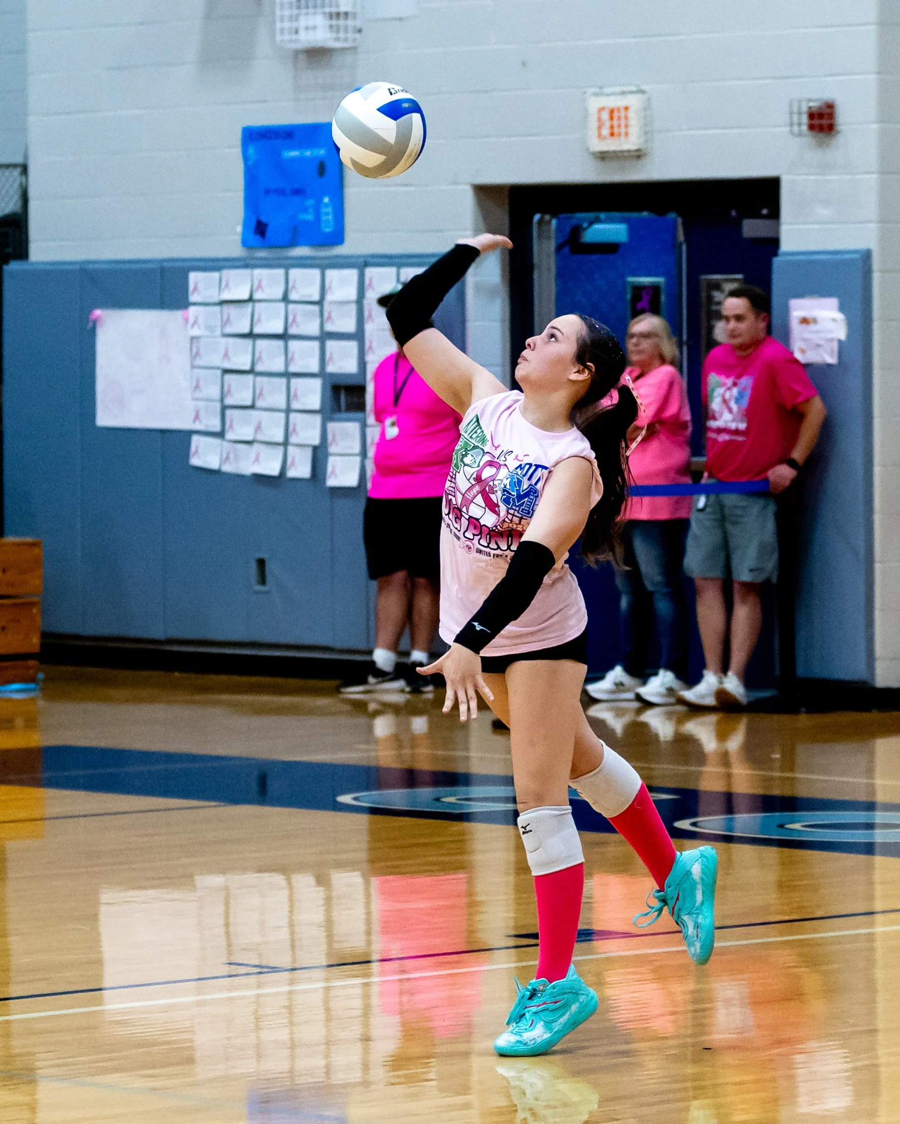 Mott player serves the ball