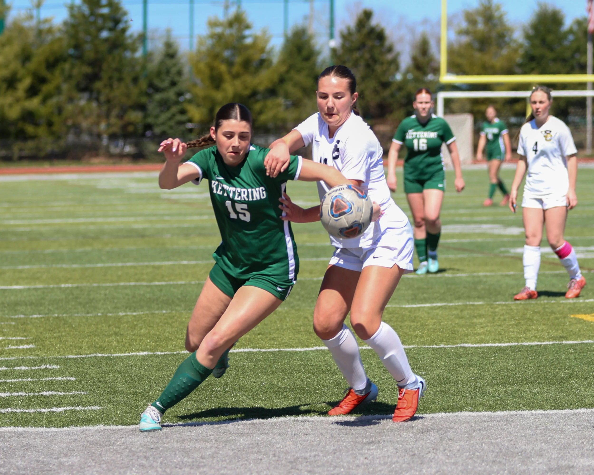 #15 battles for the ball