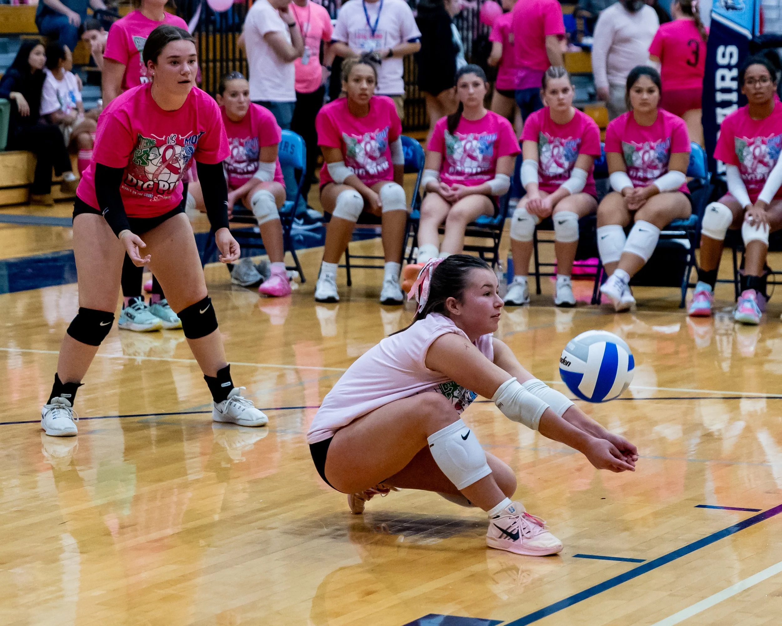  Kettering player hits the ball