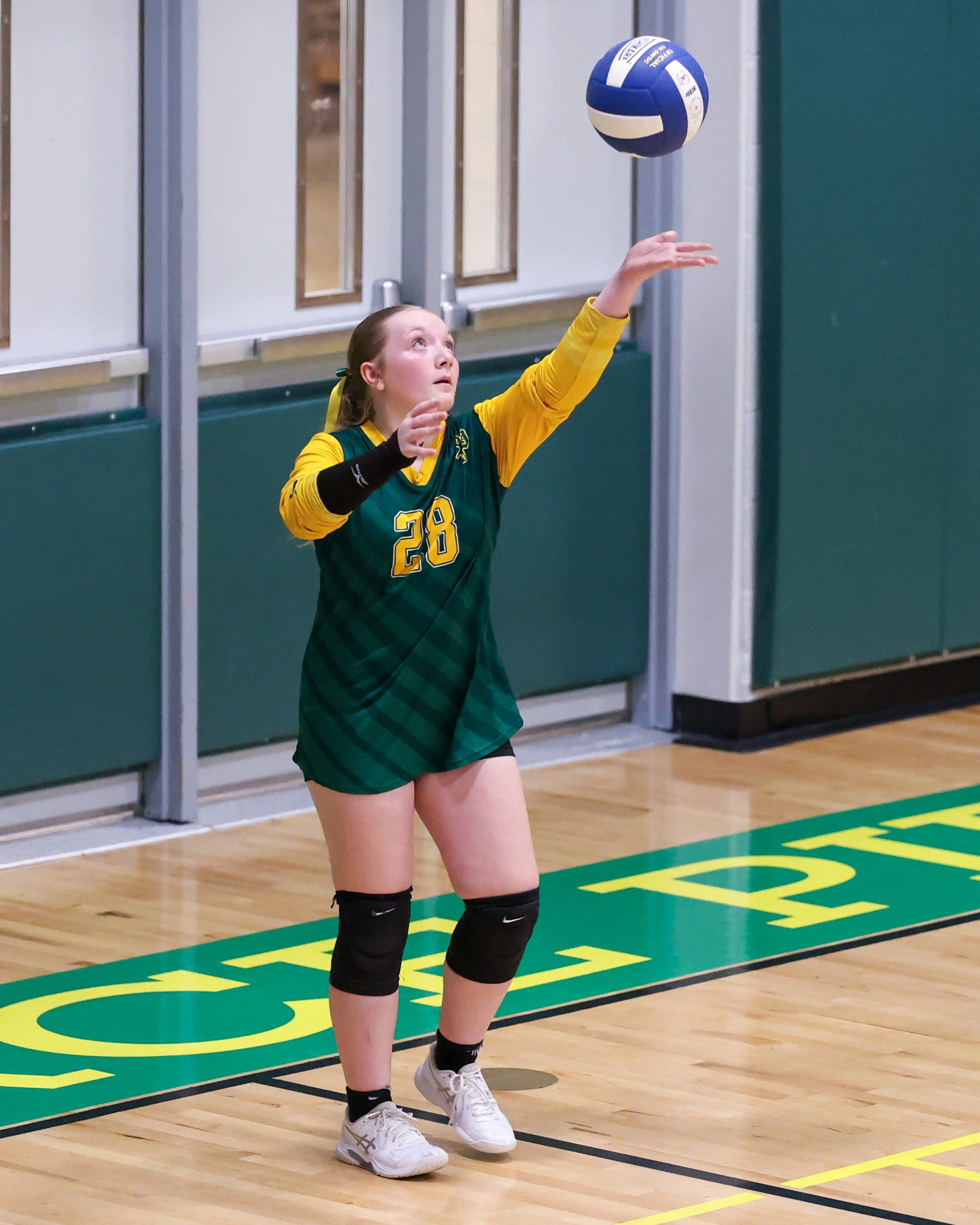 Pierce #28 serves the ball