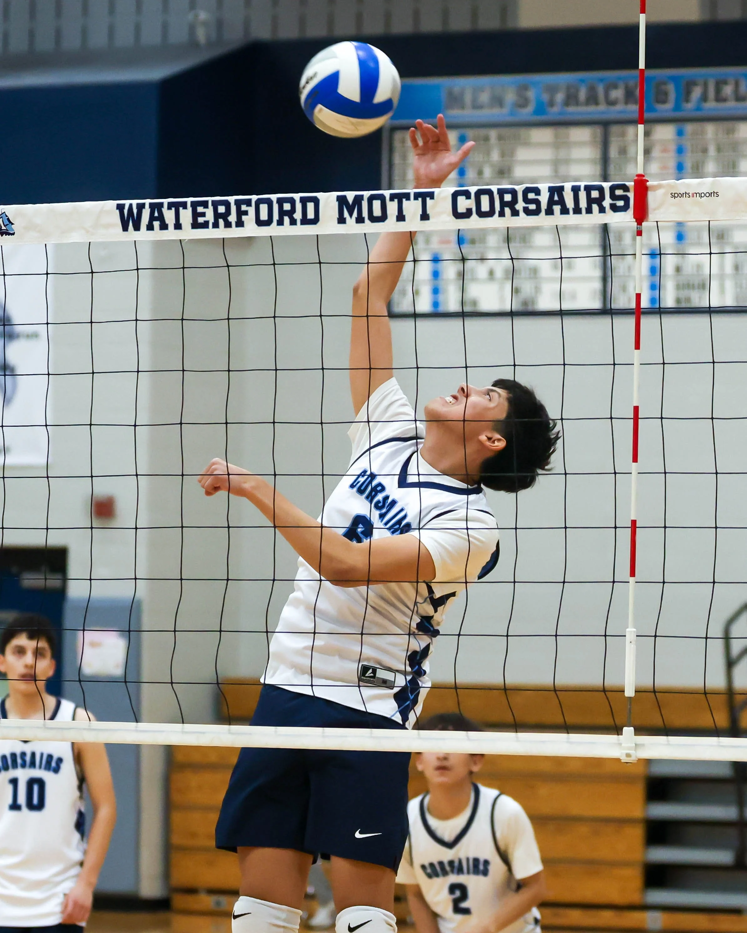 Mott #6 spikes the ball