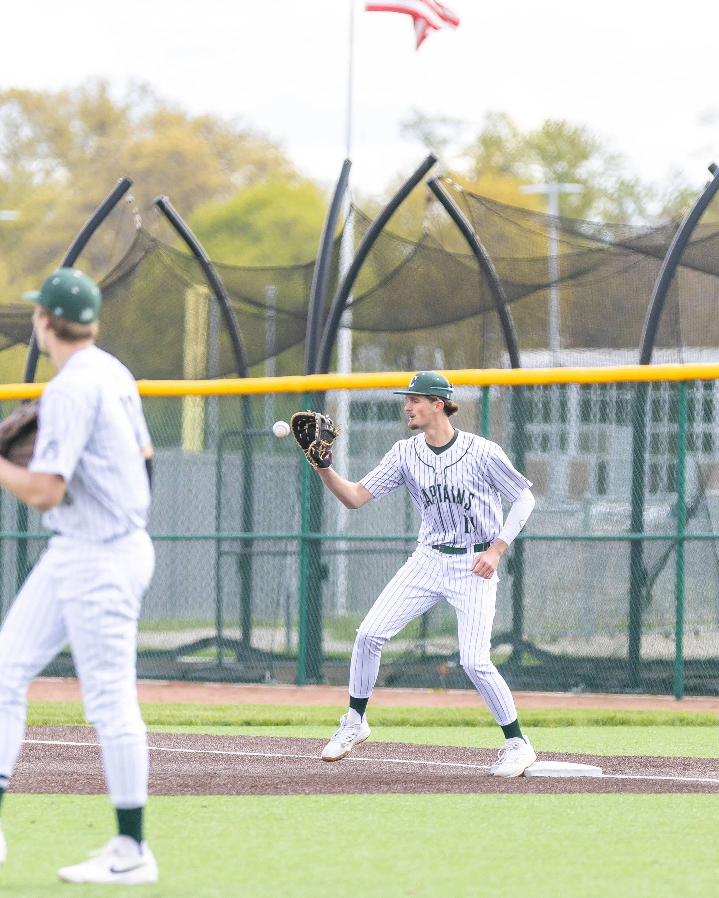 Kettering #11 catches the ball at 1st base