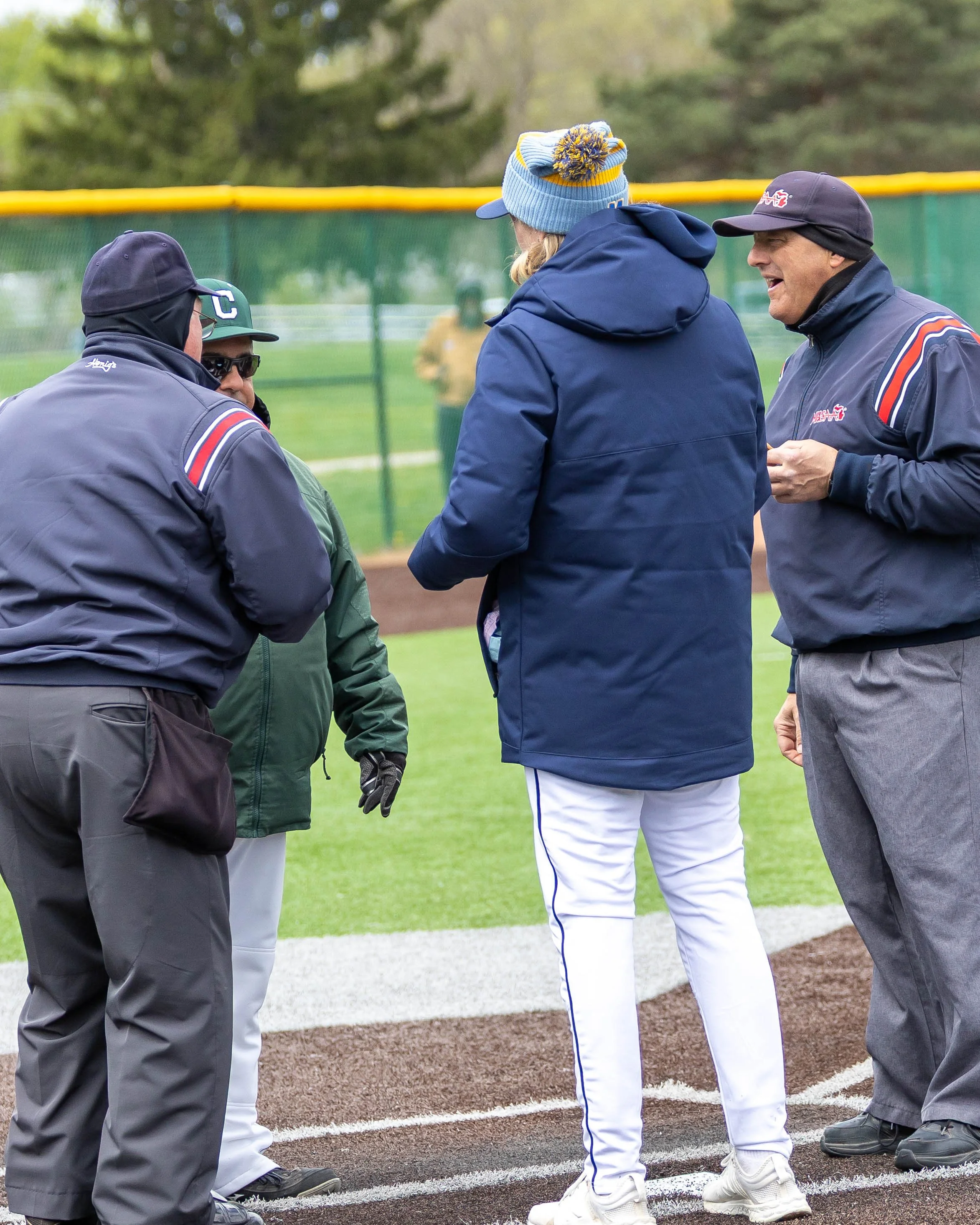 Game 2 coaches and umpire meeting