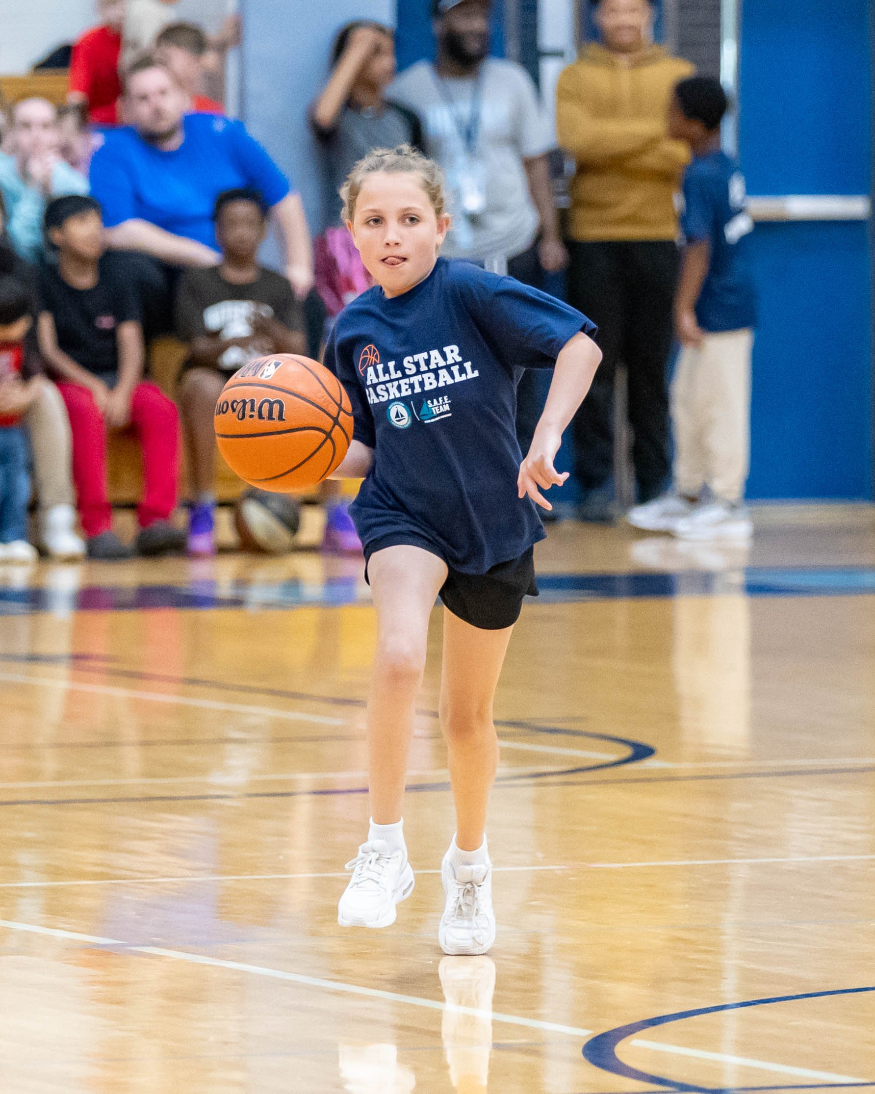 North girl dribbles the ball