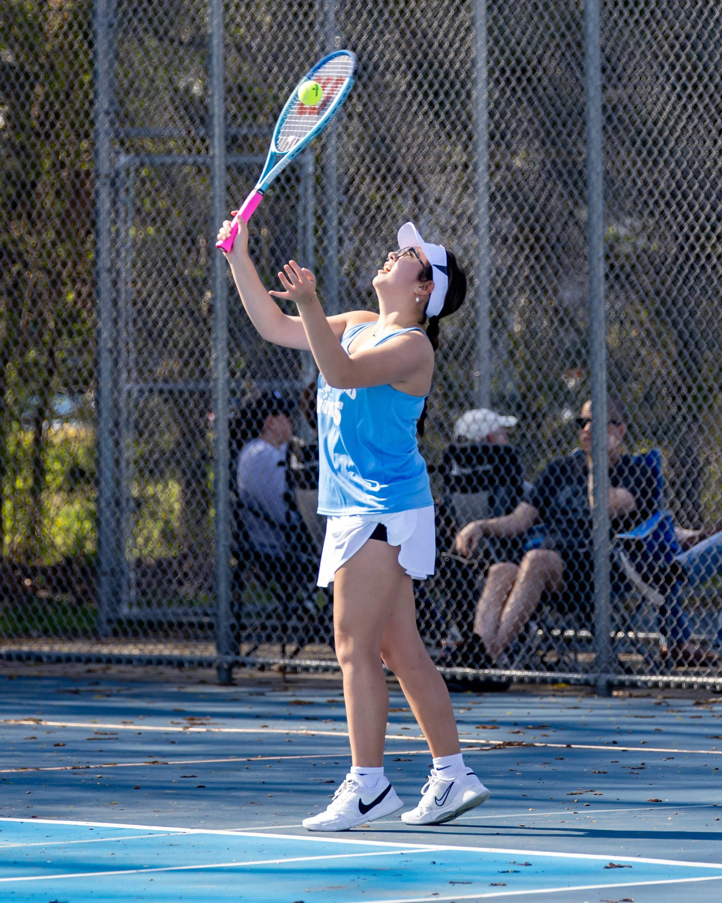 Waterford United player serves the ball