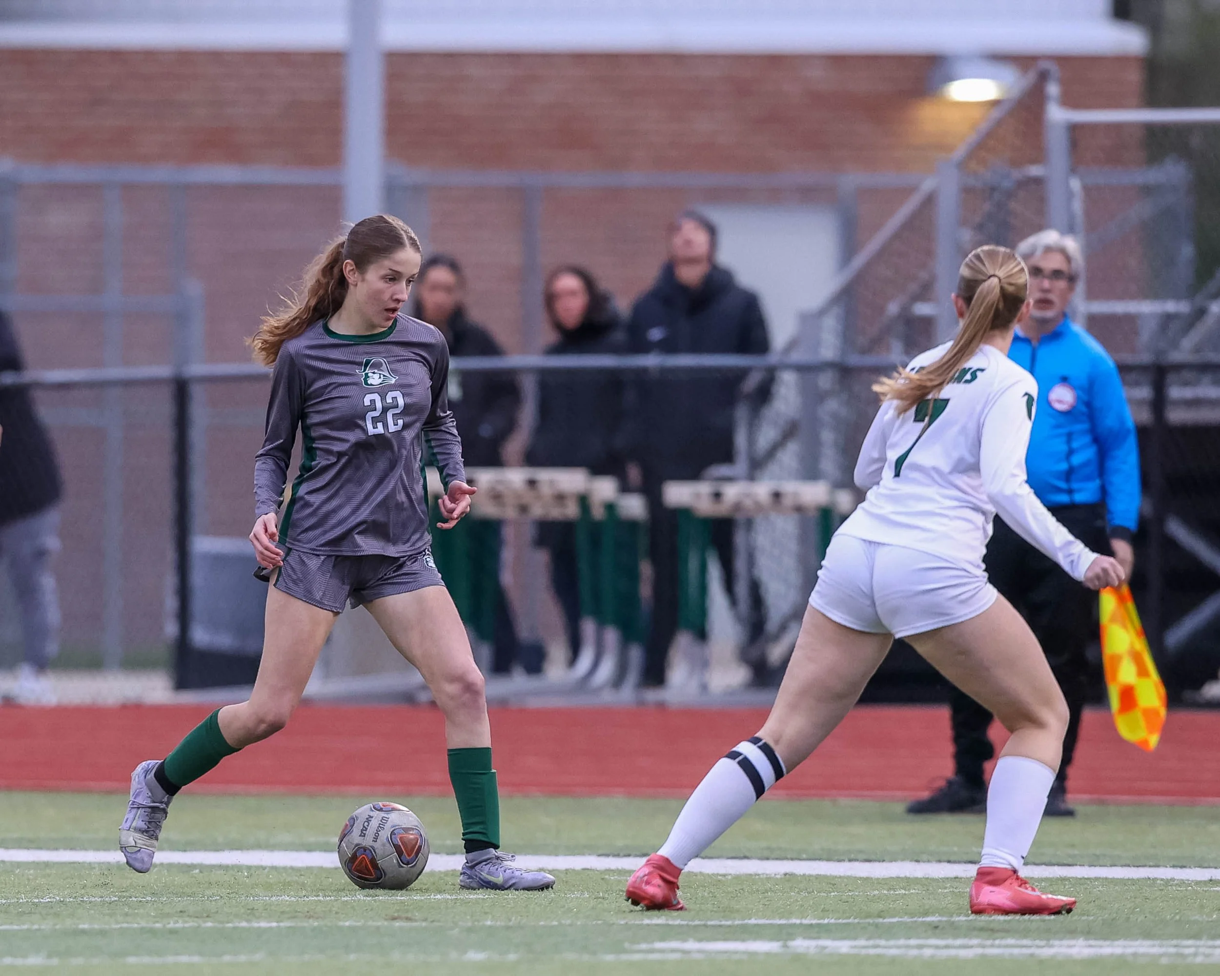 #22 kicks the ball