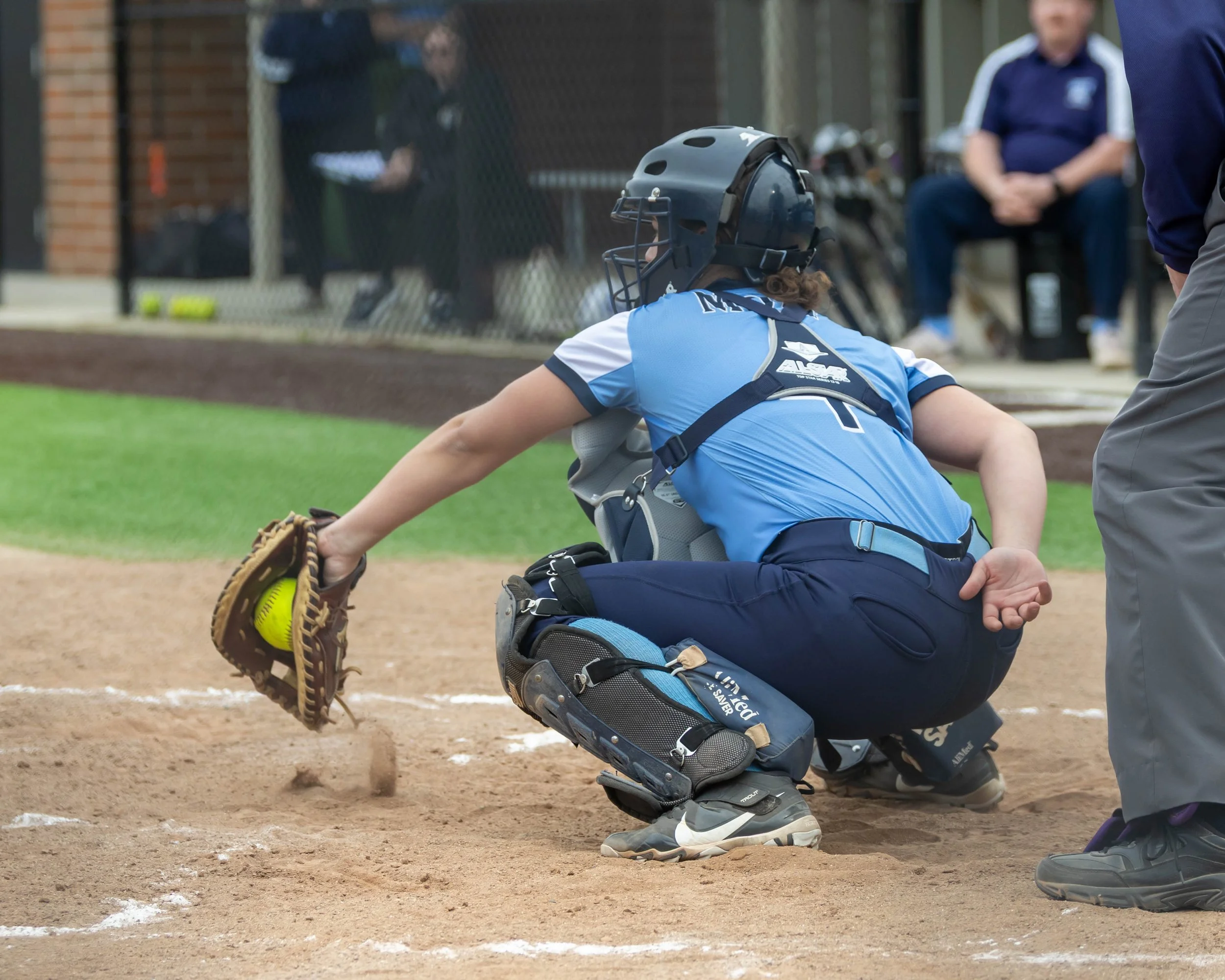 Mott catcher stops a ball in the dirt