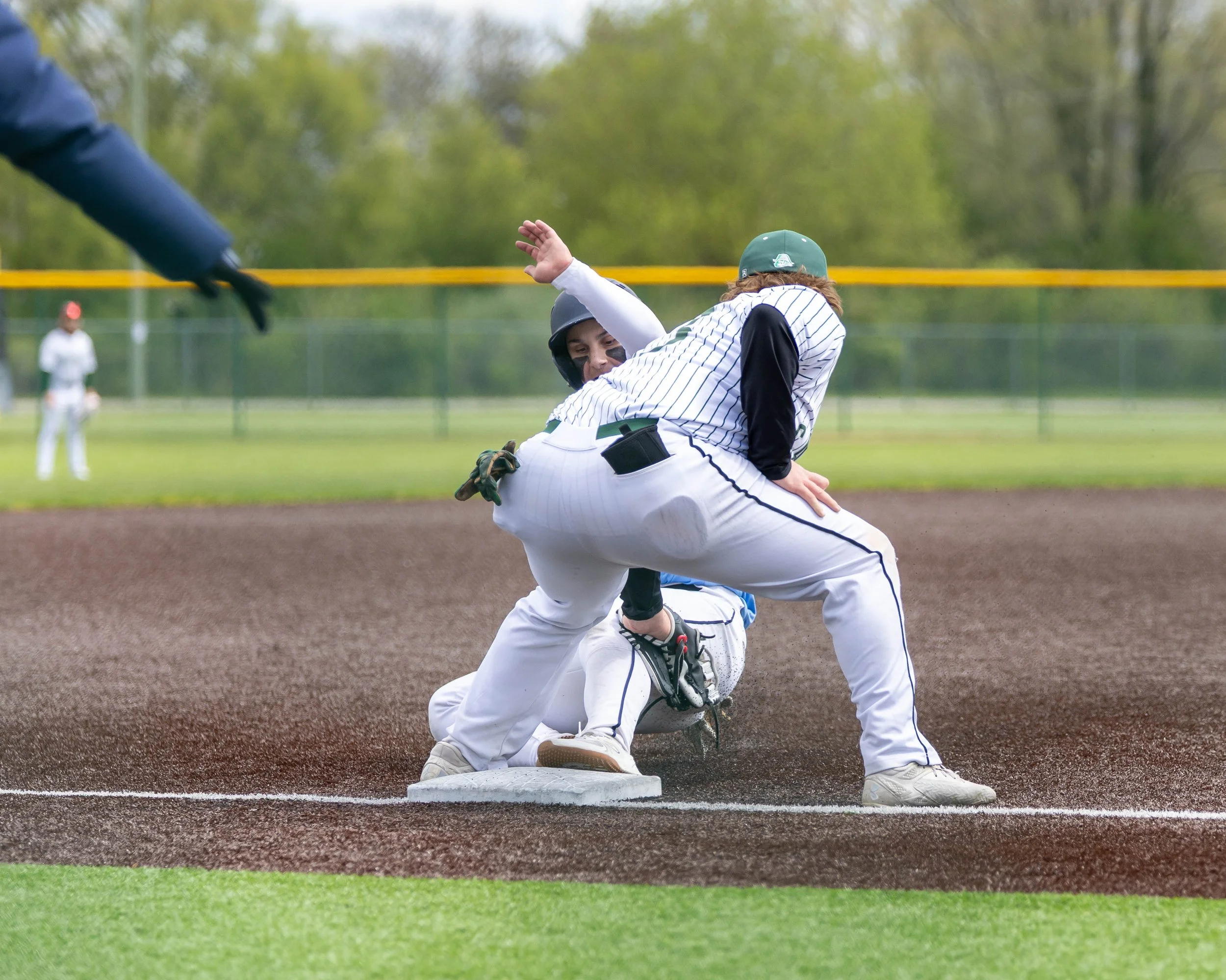 Mott player slides into 3rd base