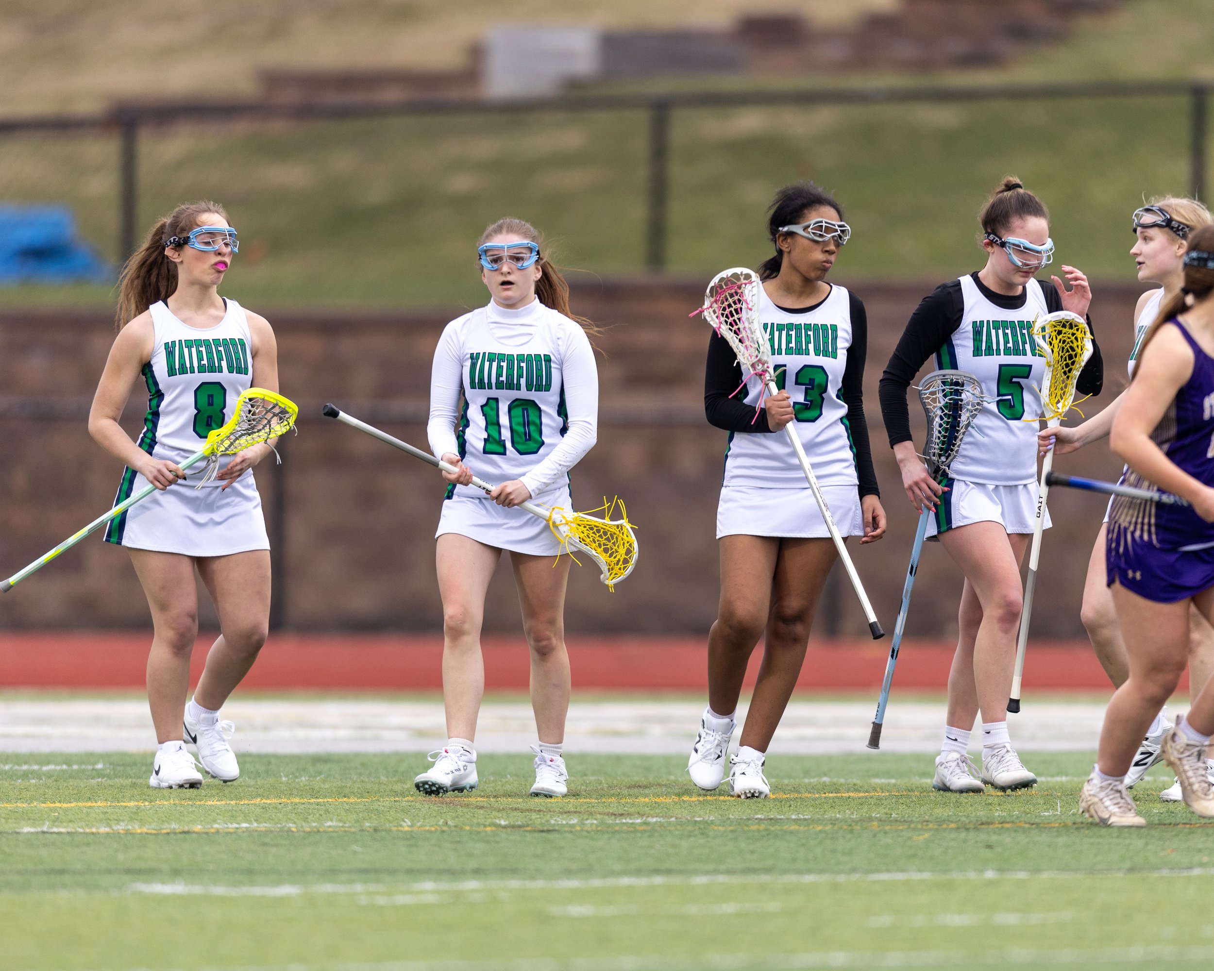 #10 celebrates with teammate's