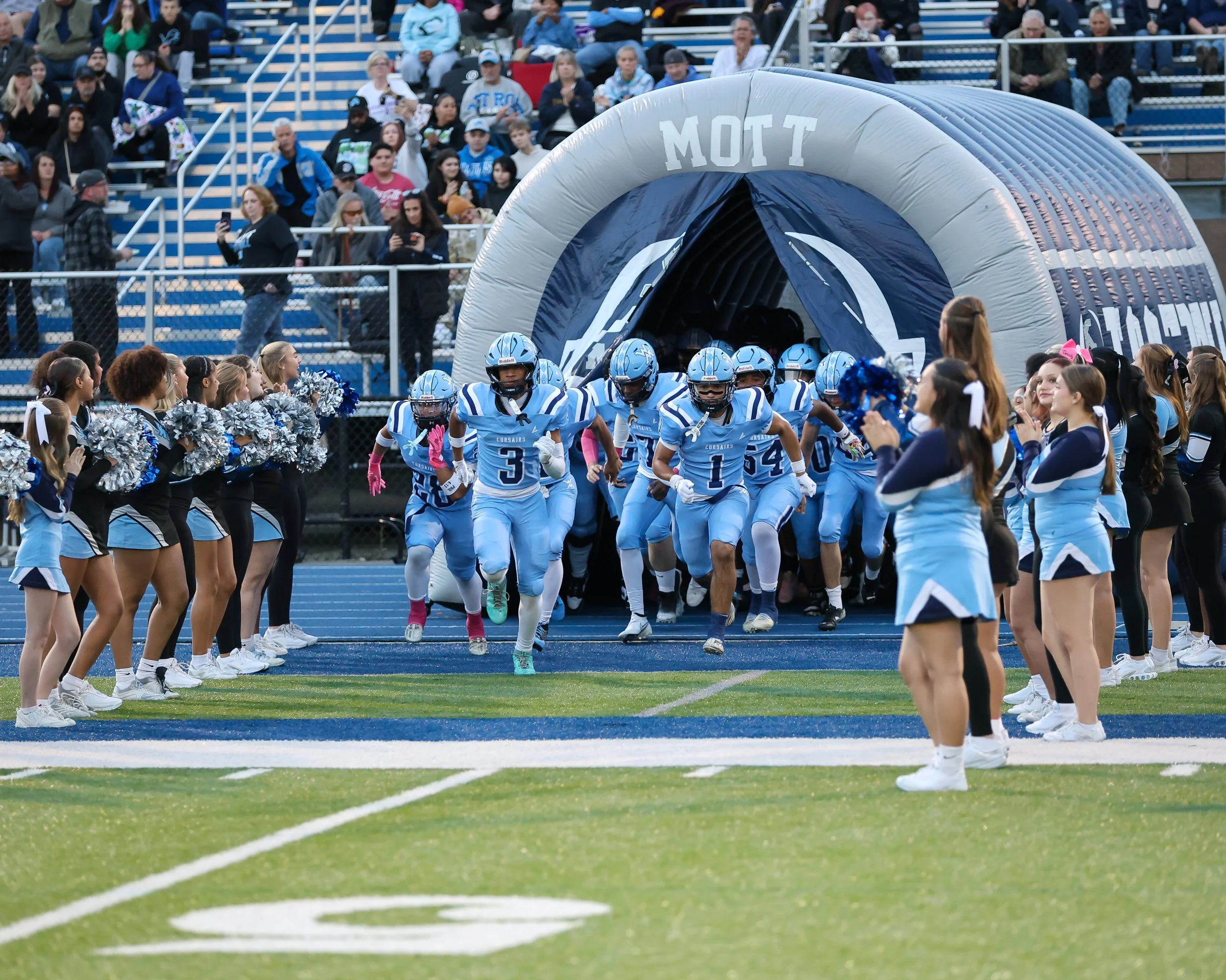 Mott Football players from tunnel