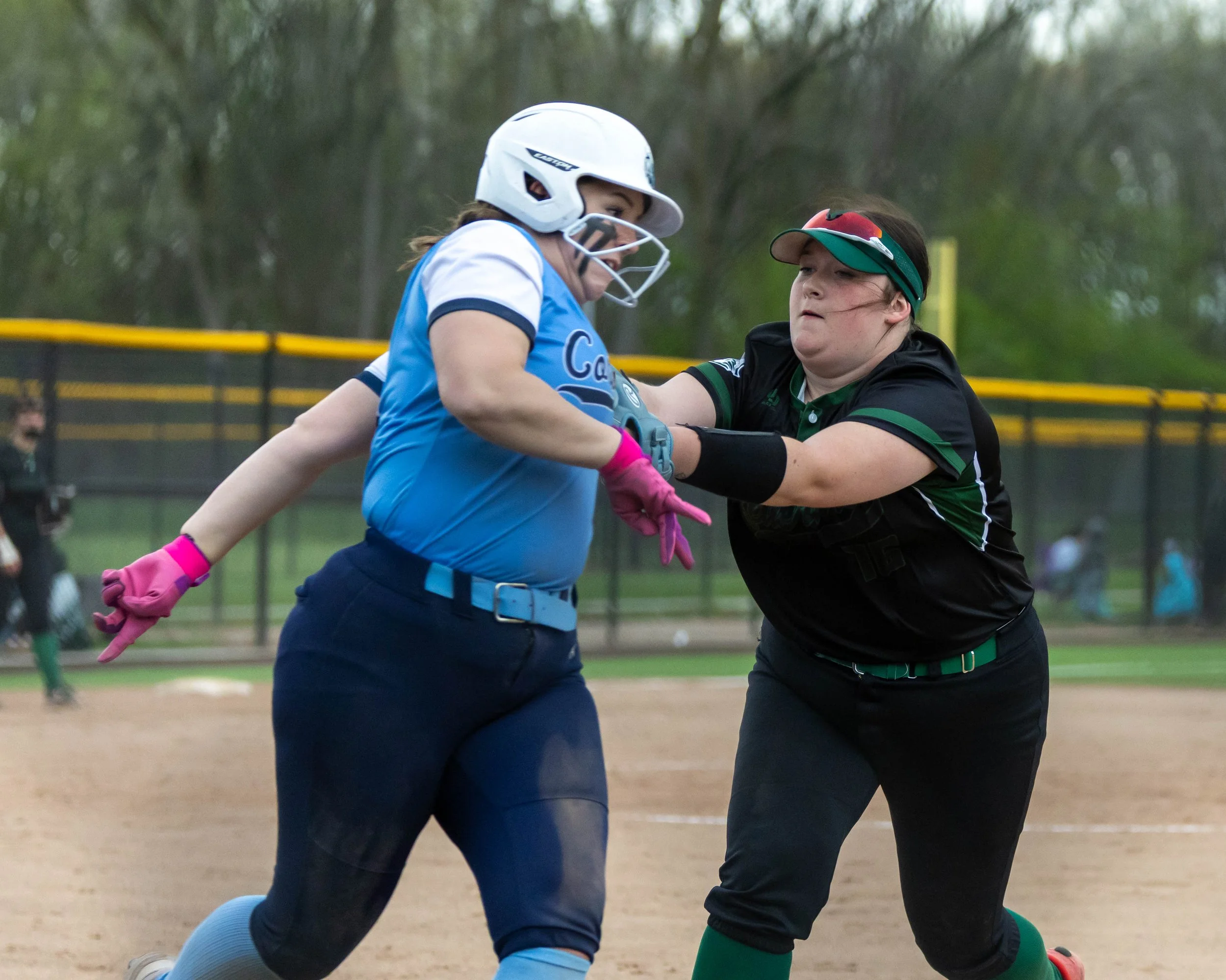 Kettering first base tags the Mott player out
