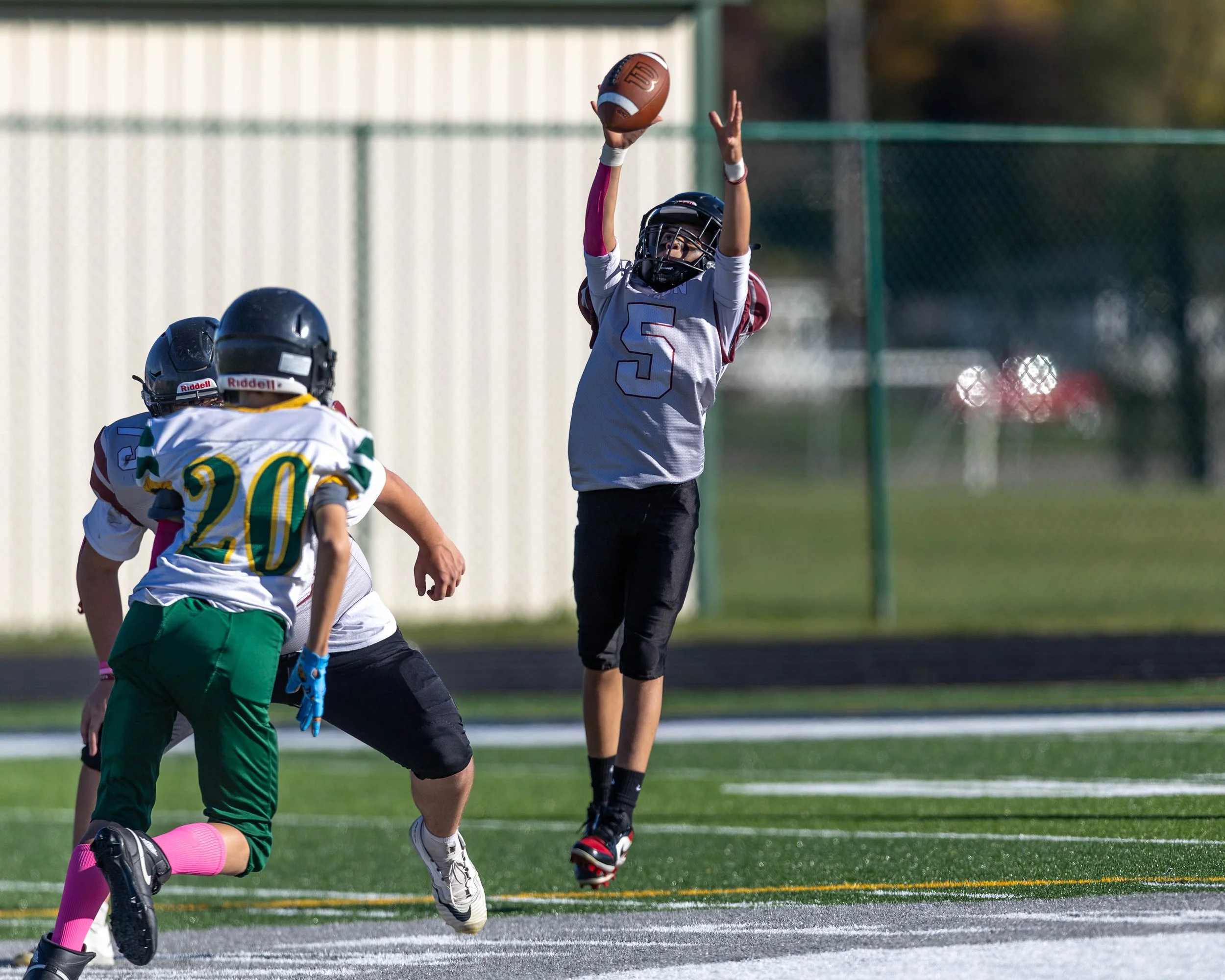Mason #5 leaps for the ball