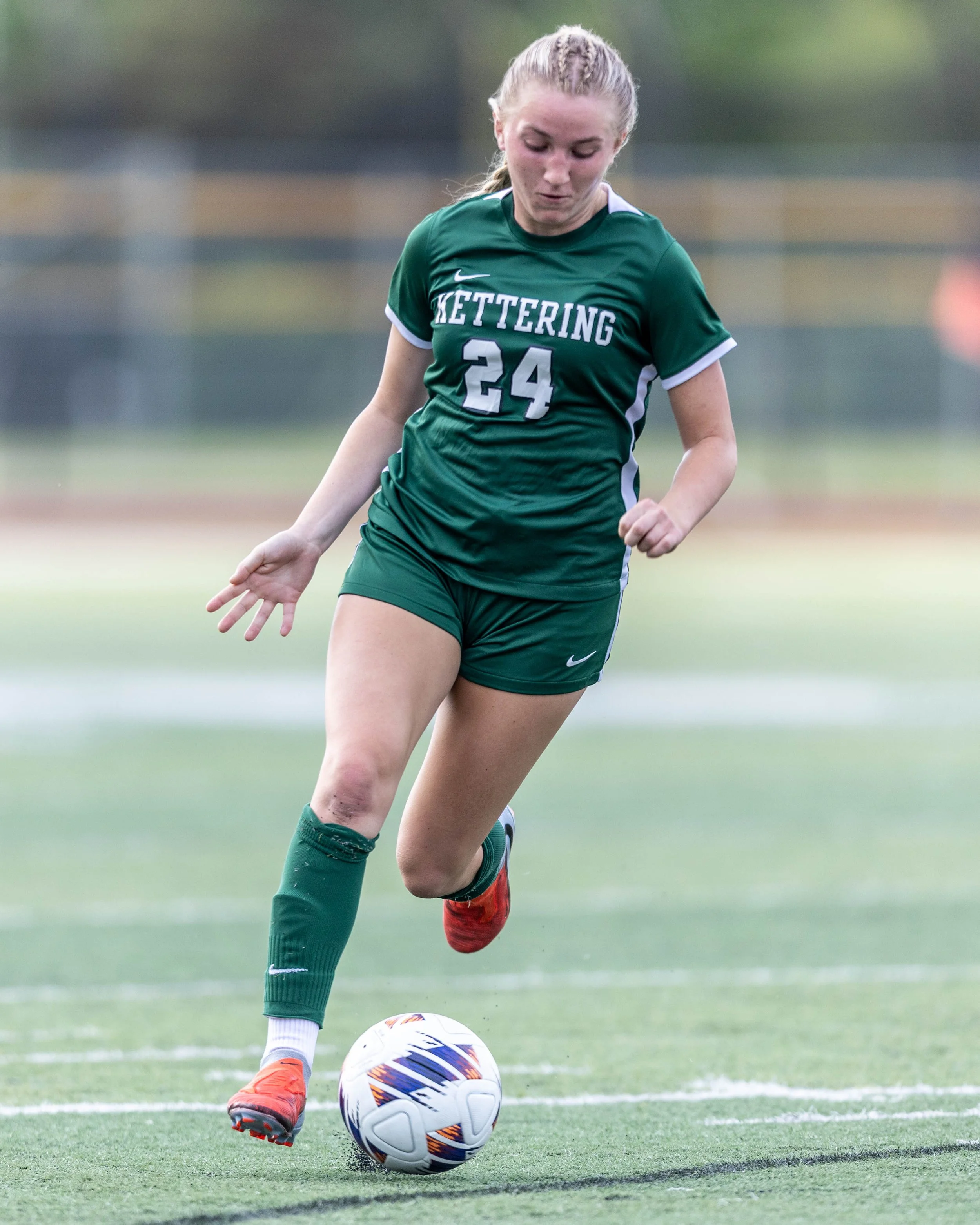 #24 dribbles the ball
