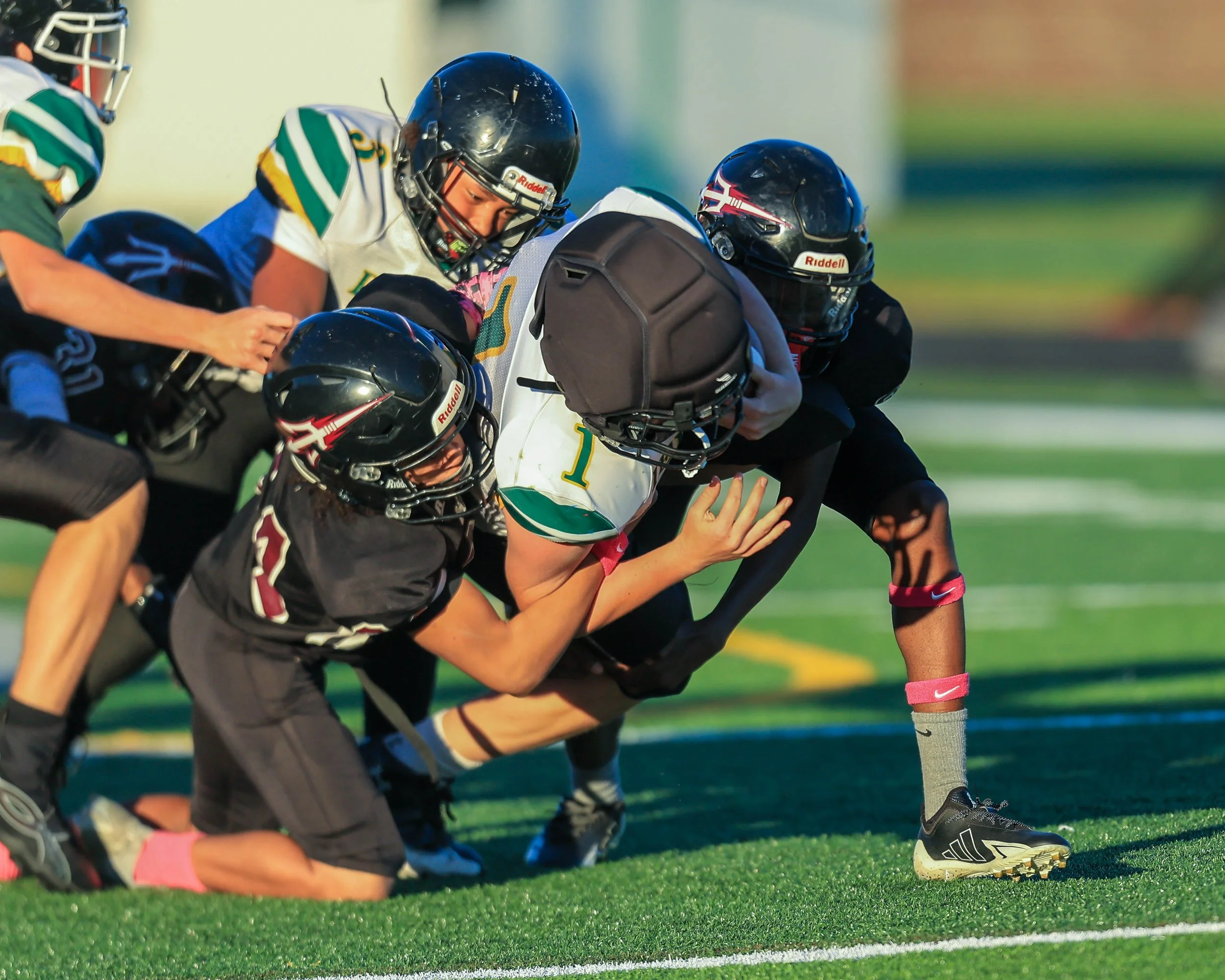 Pierce #1 tackled by Mason players