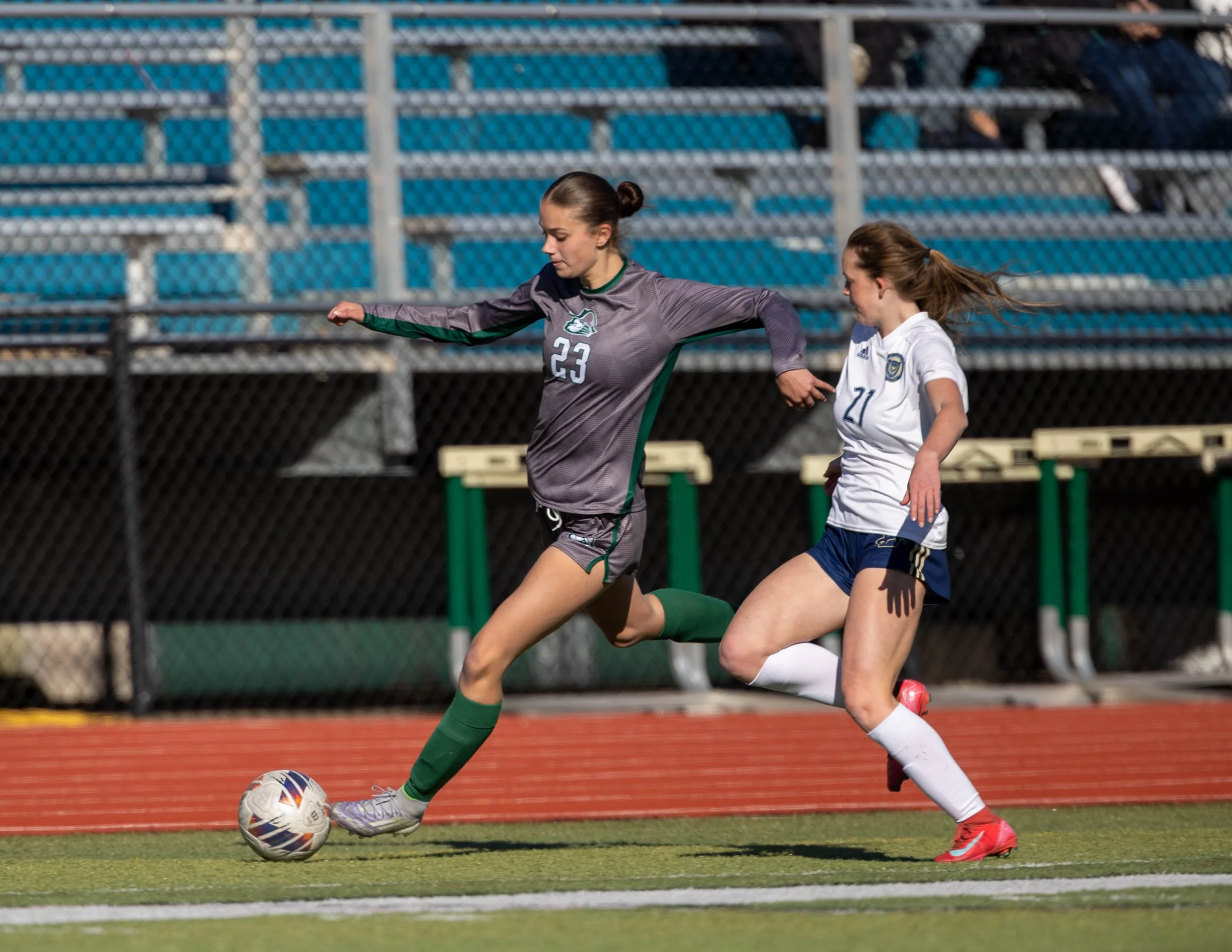 #23 tips the ball with her toe