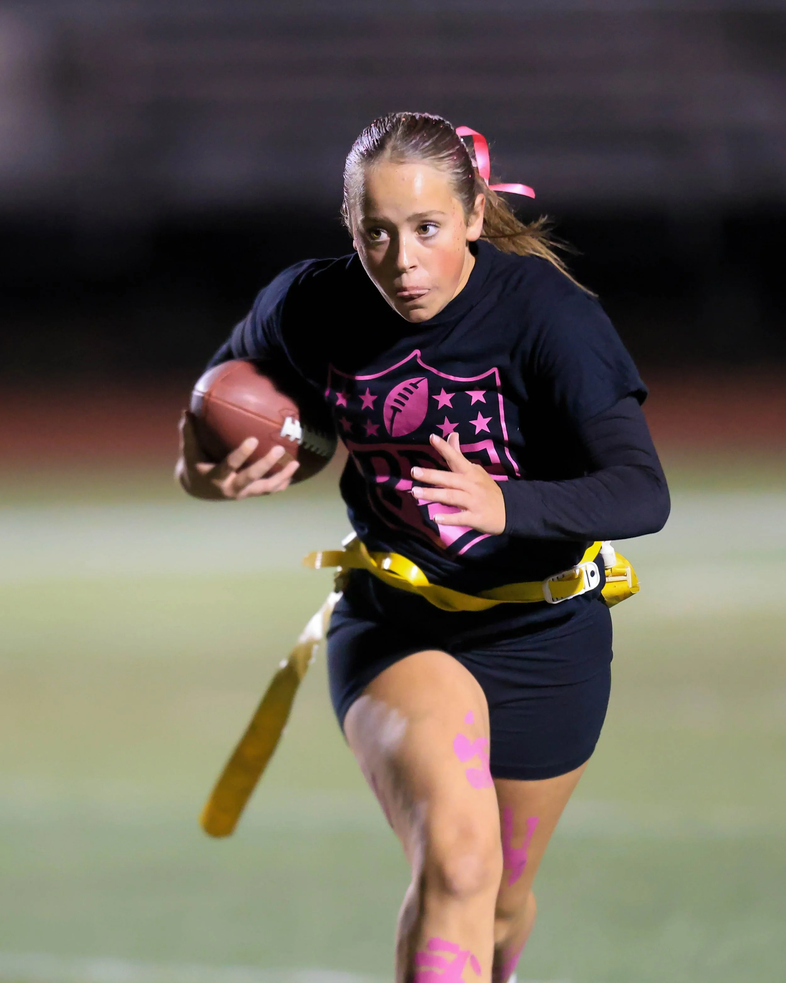 Senior quarterback running with the ball