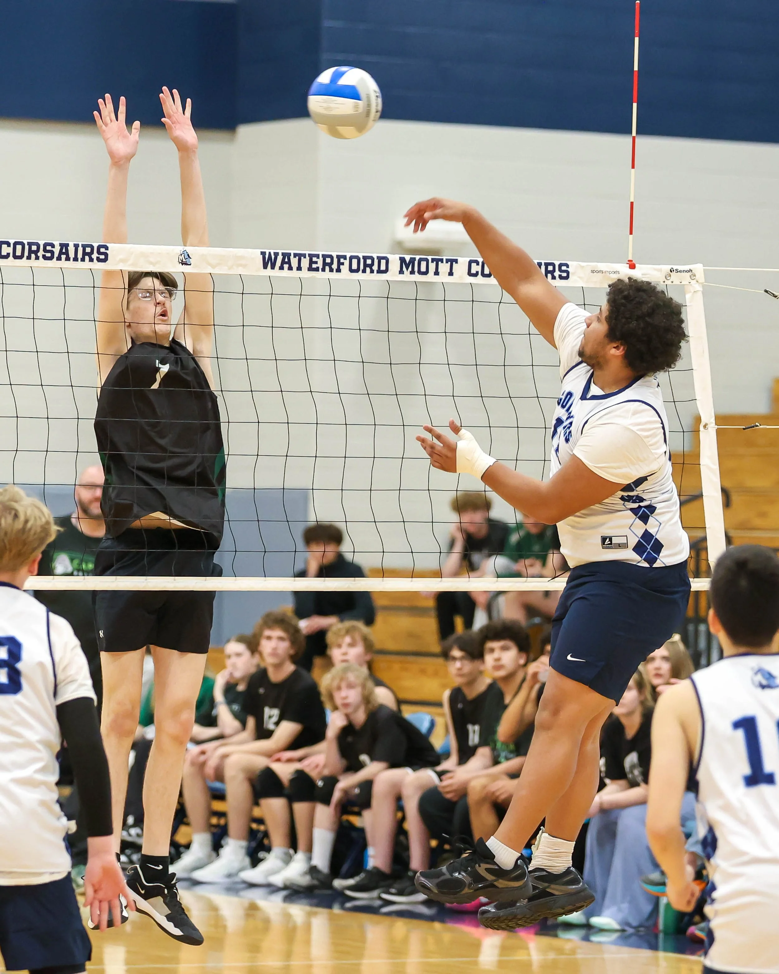 Mott #13 spikes the ball