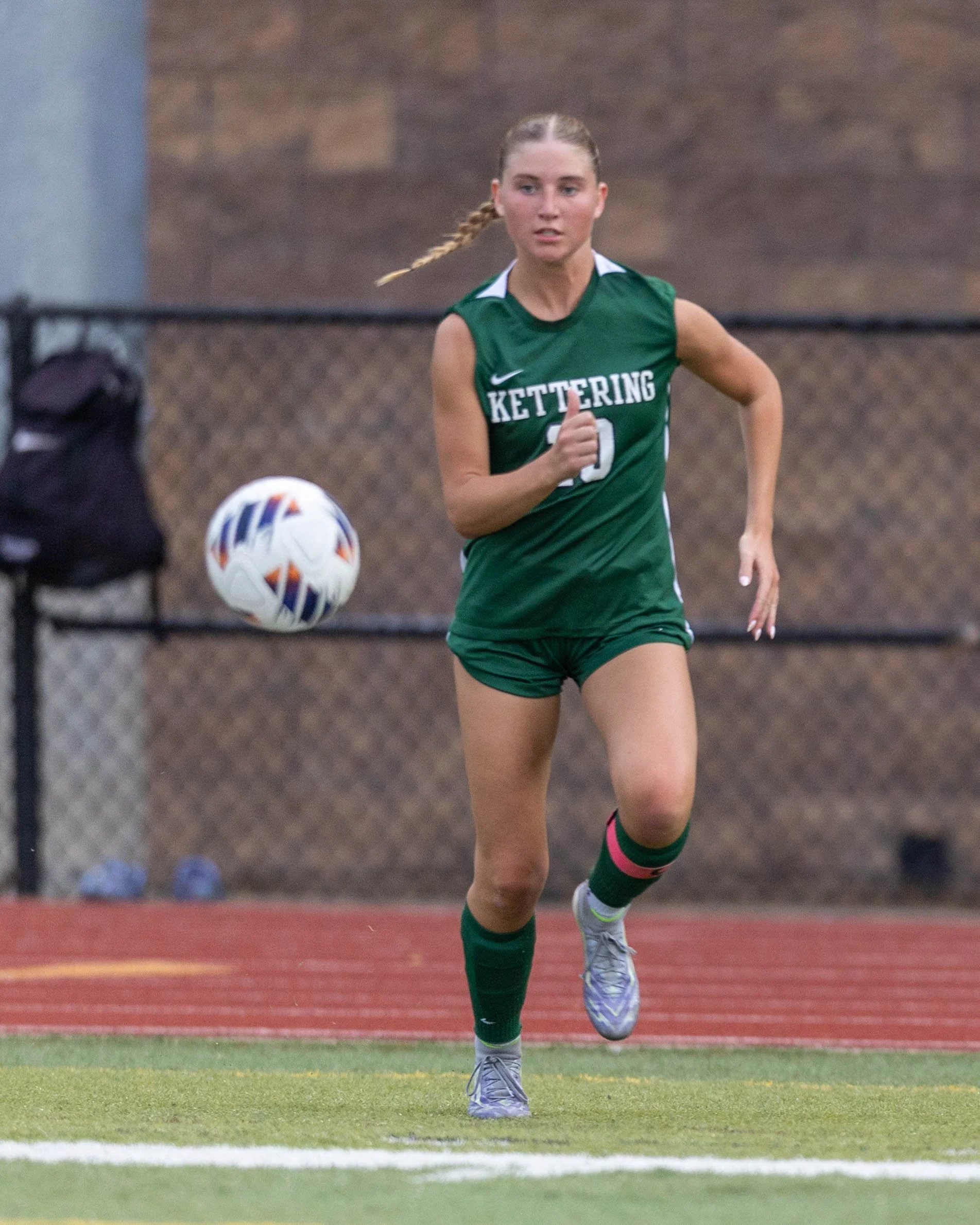 #10 chases the ball in the air