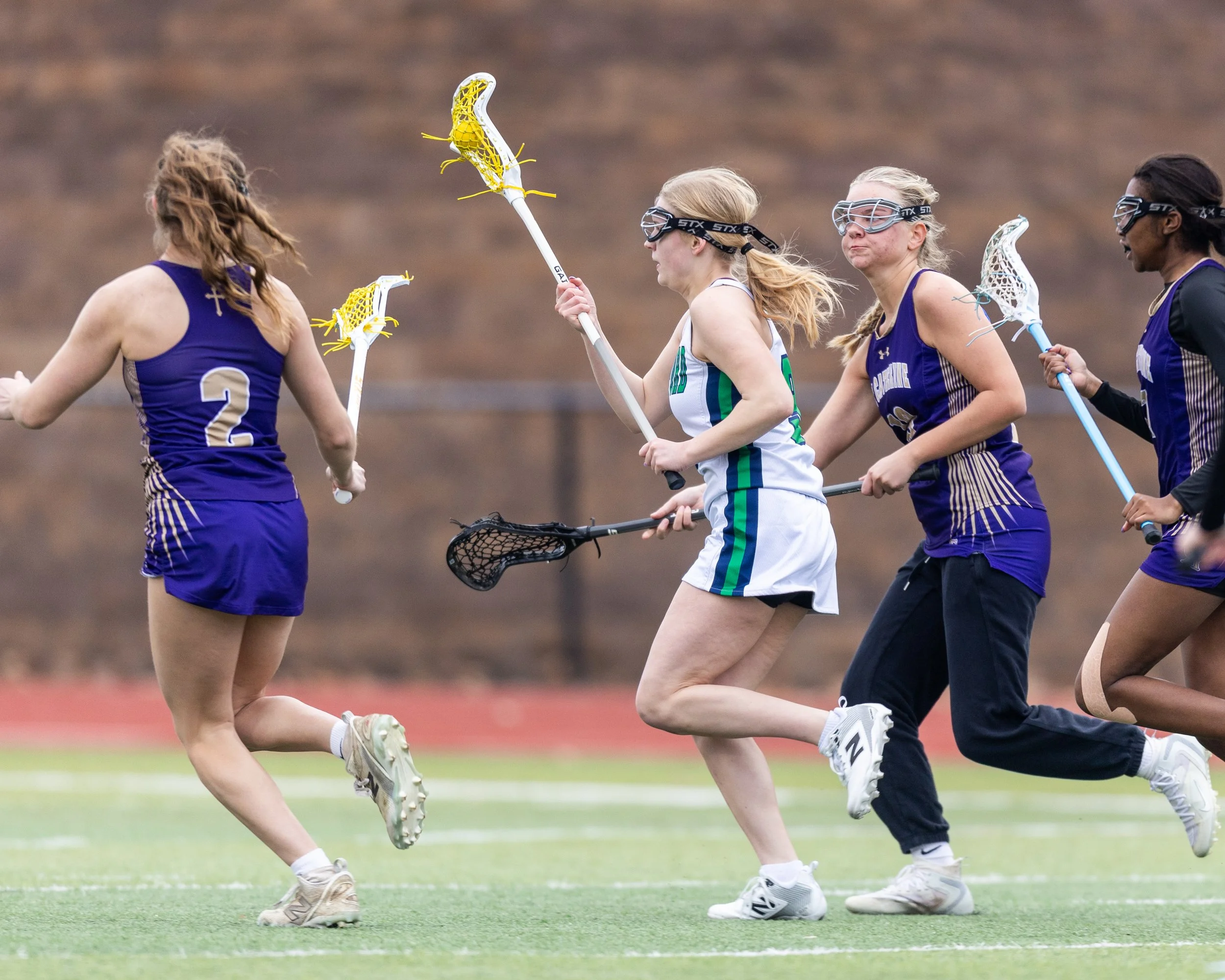 #9 carries the ball through defenders