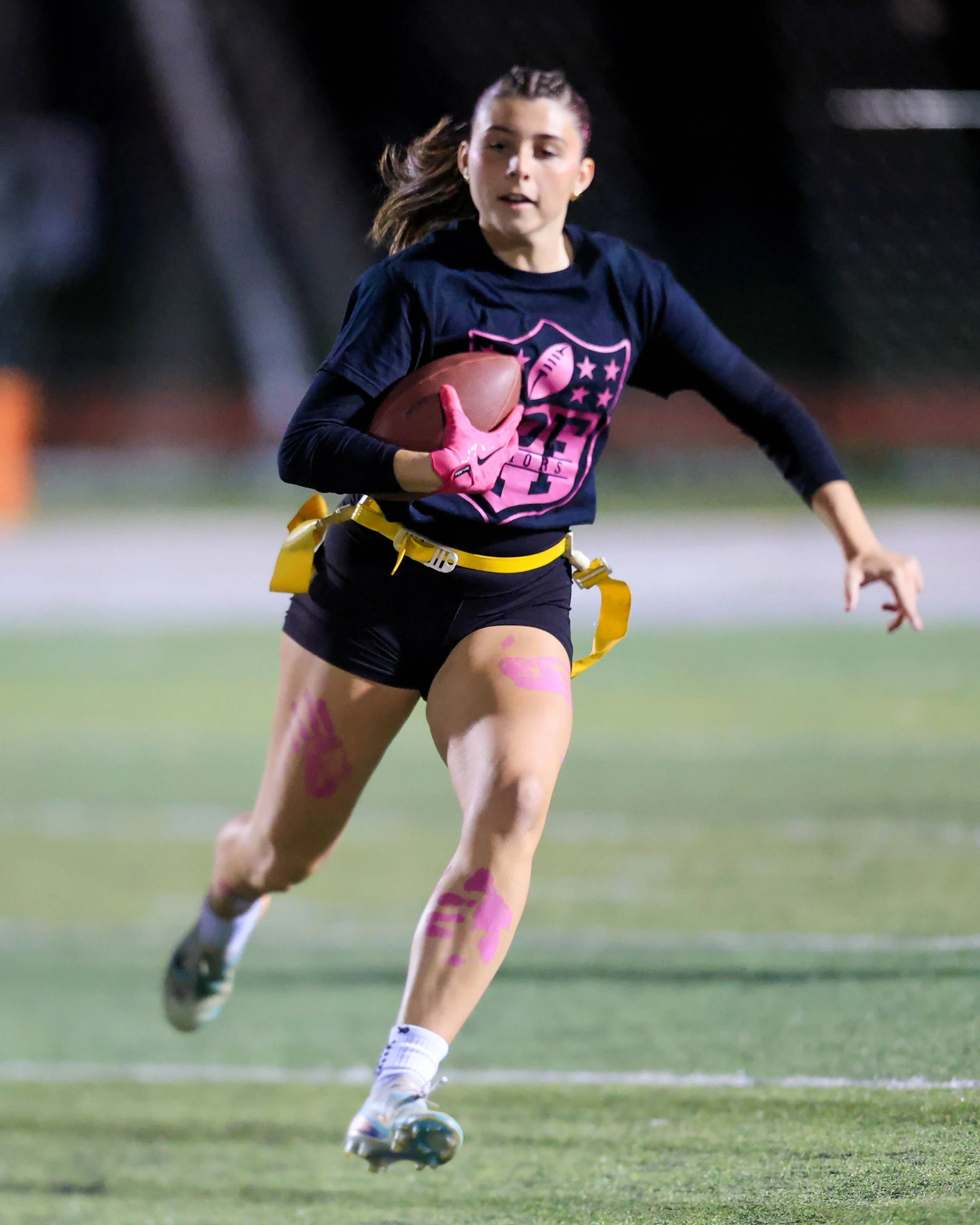 Senior running with the ball
