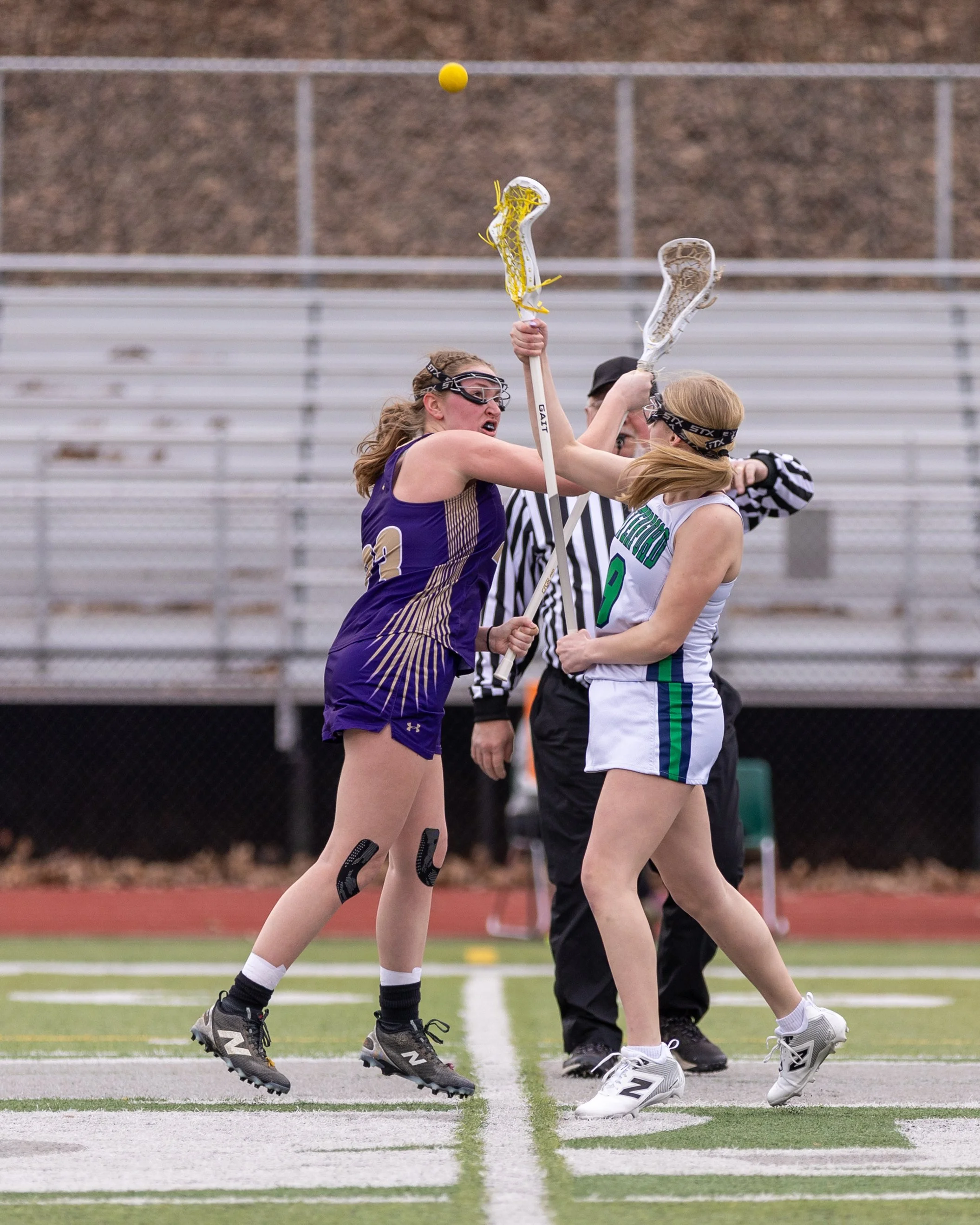 #9 faces off with the ball in the air