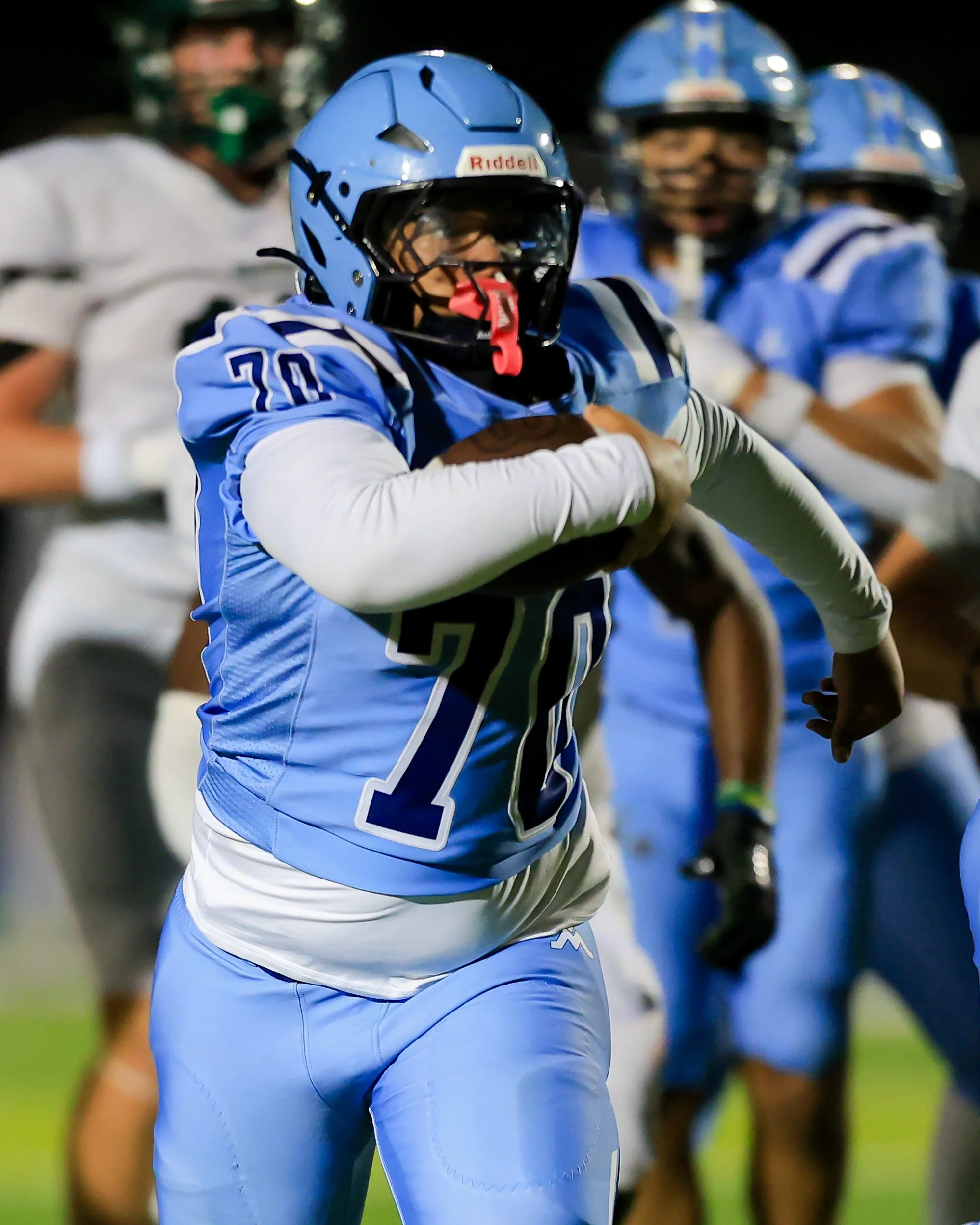 Mott #70 runs with the ball