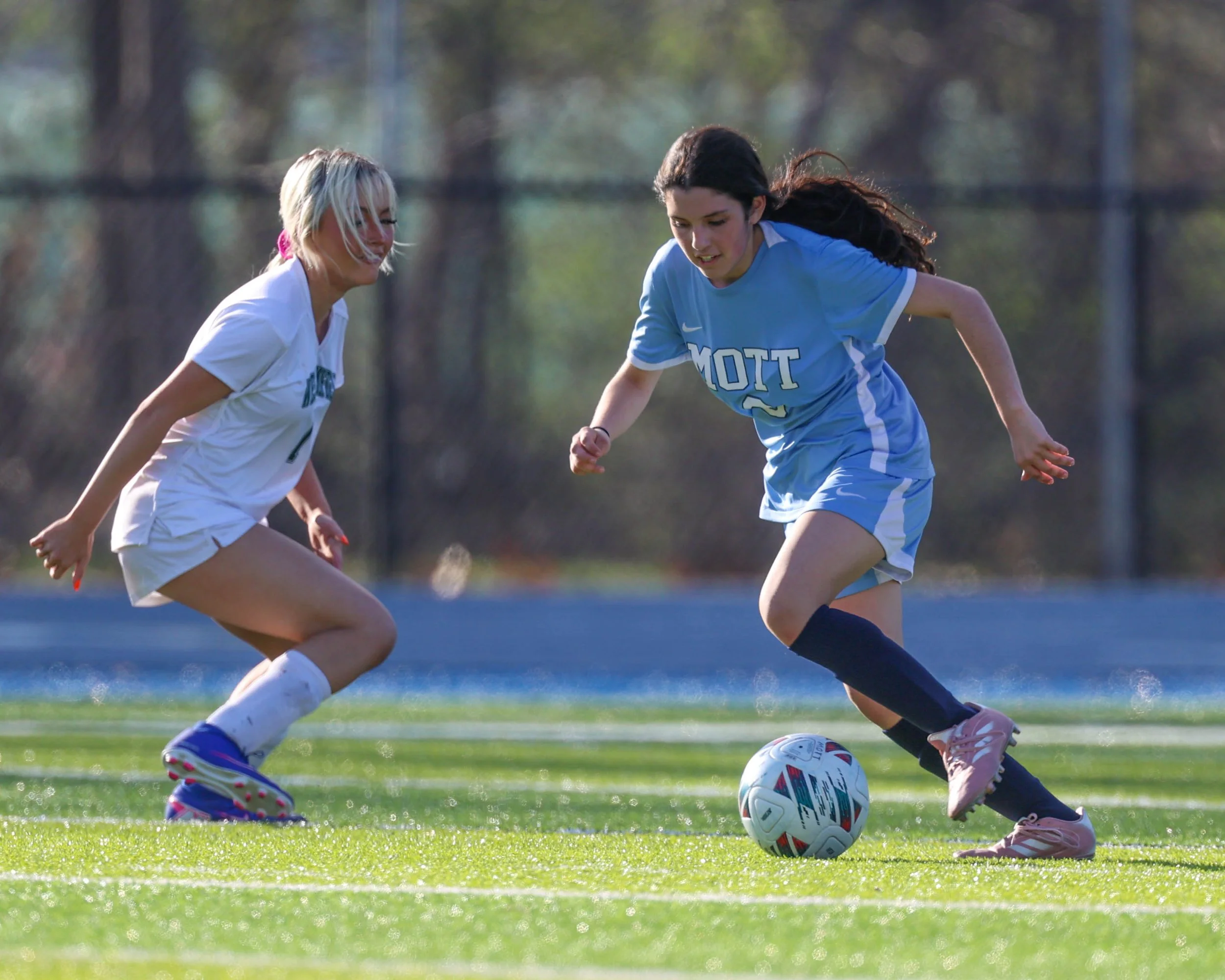 #8 dribbles the past a defender