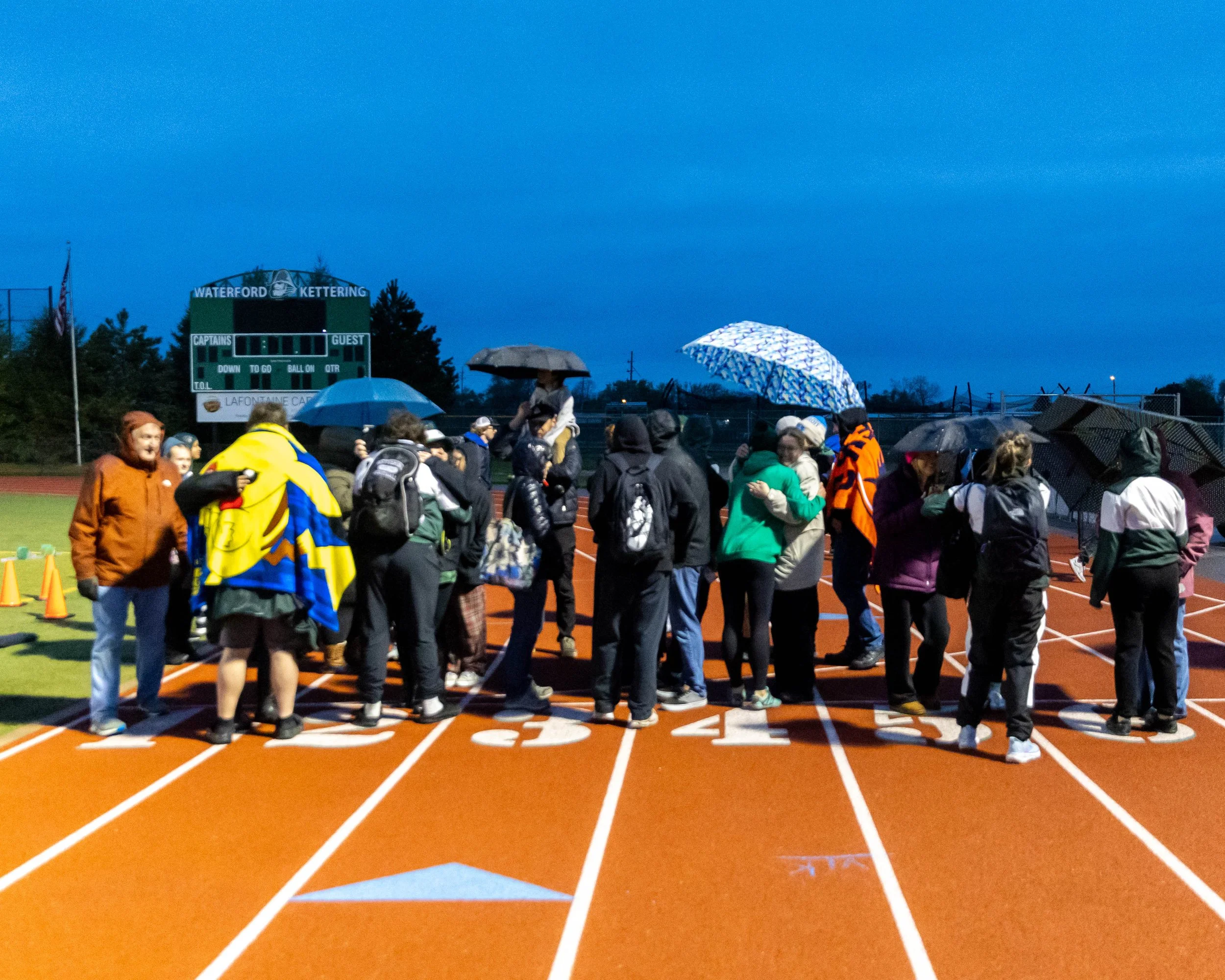 Senior track team and families