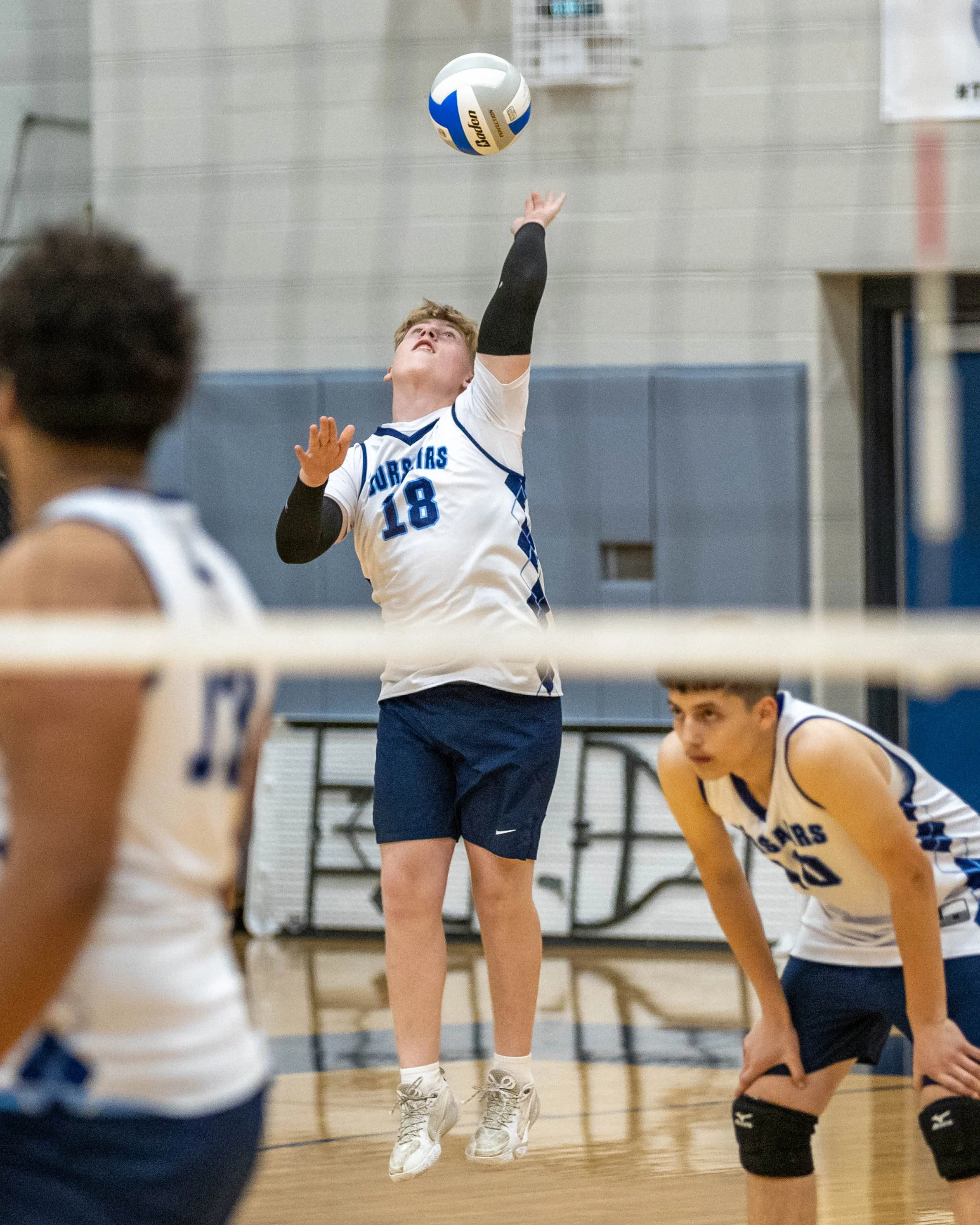 #18 serves the ball