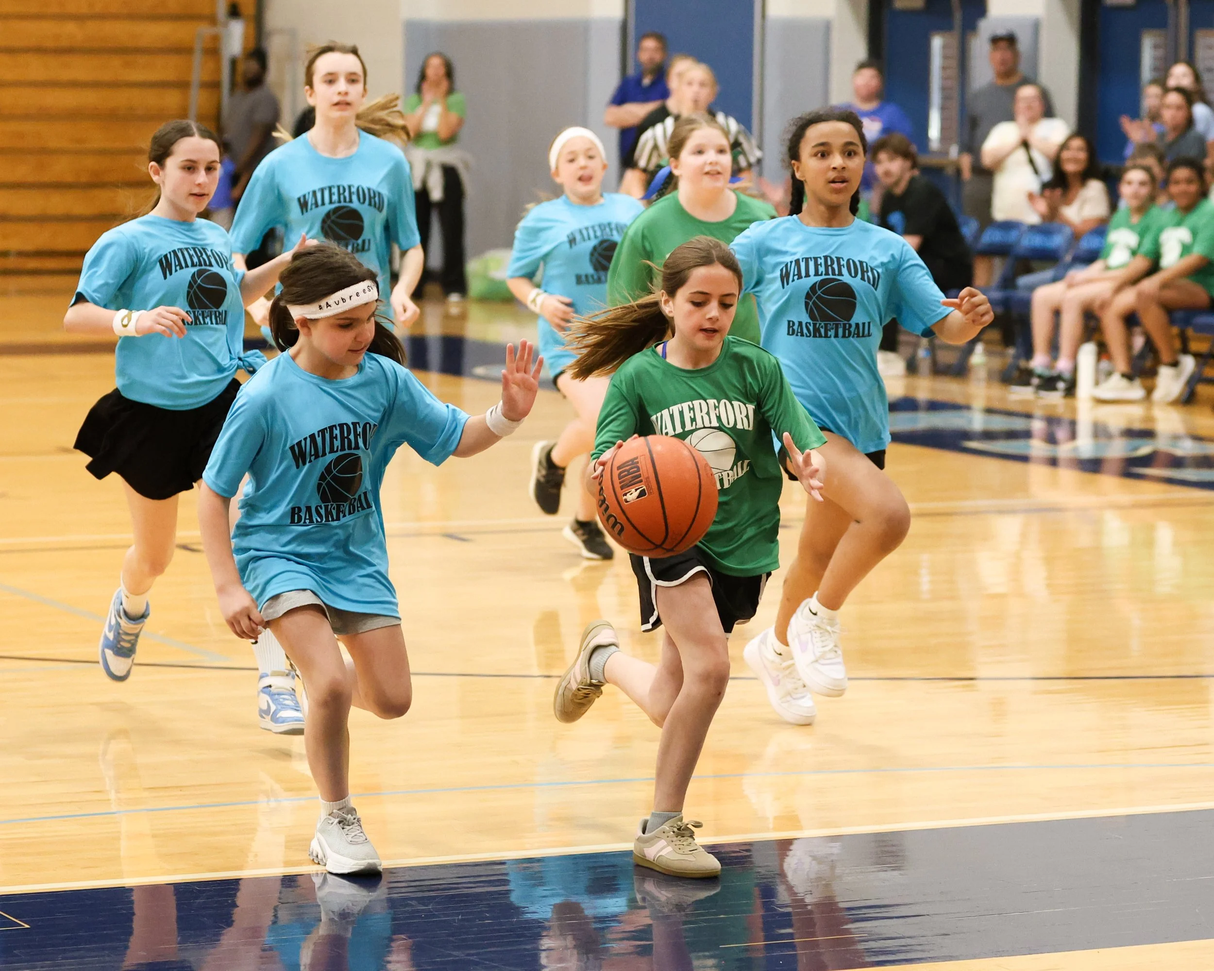 Grayson girl dribbles the ball with Cooley team running after her