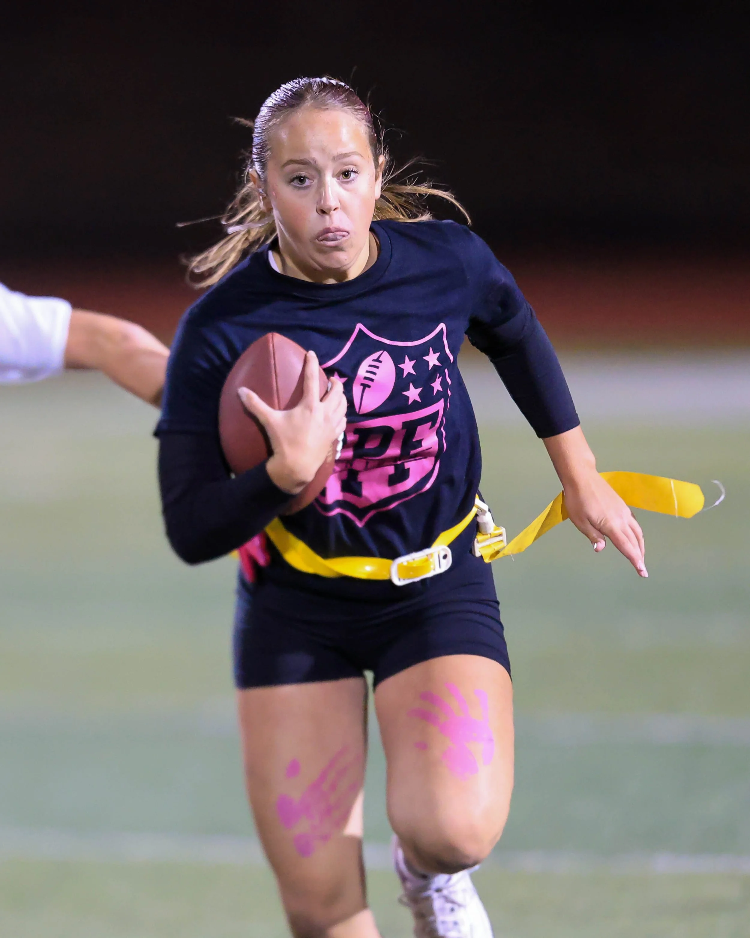 Senior quarterback runs with the ball
