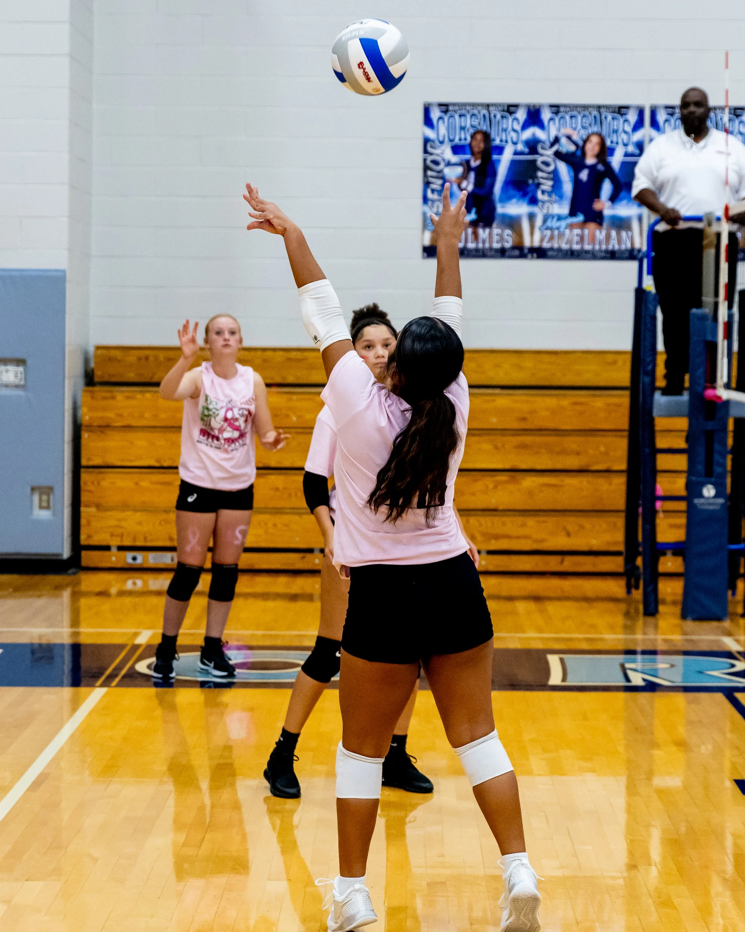 Mason player hits the ball