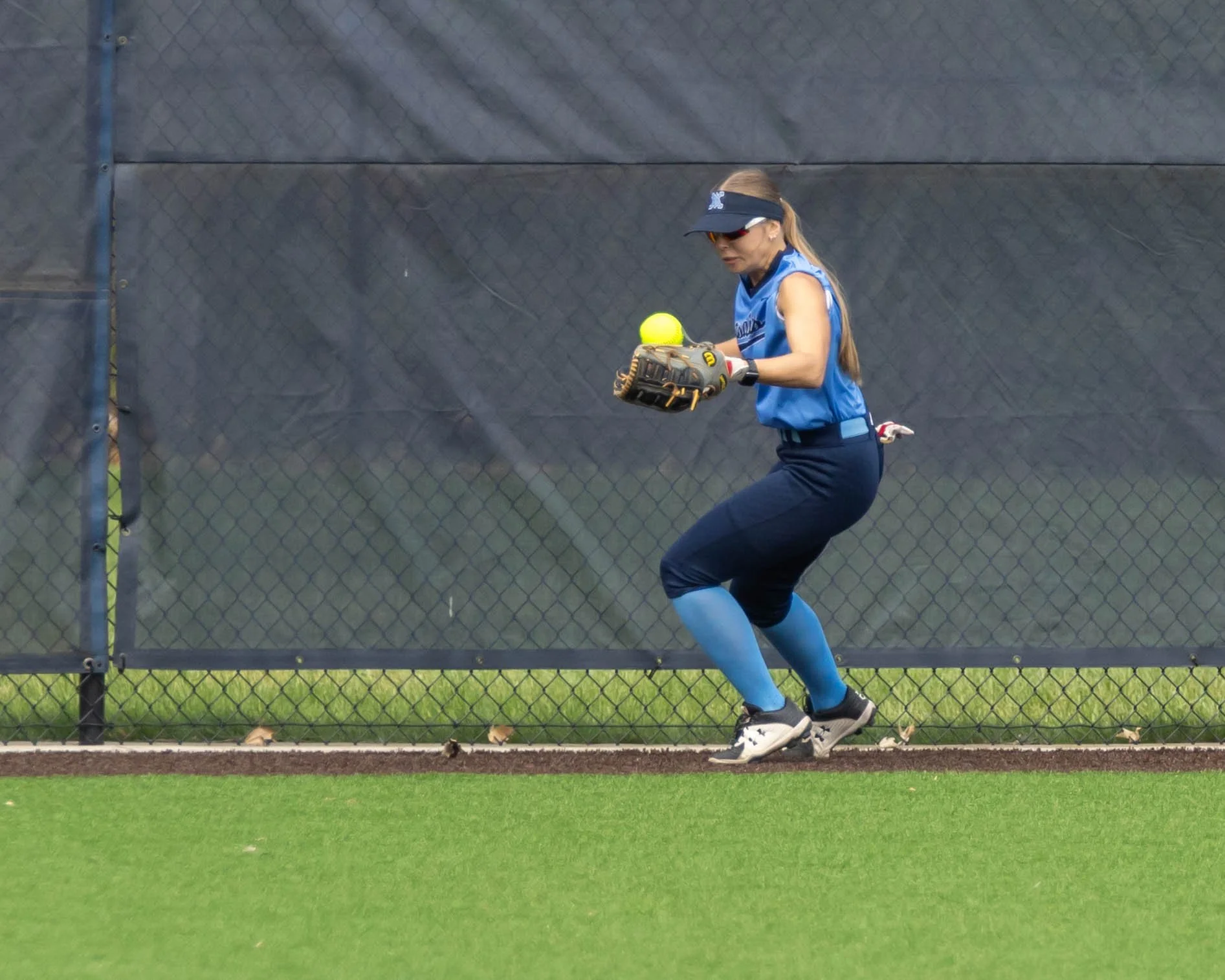 Mott #4 picks up the ball in the outfield