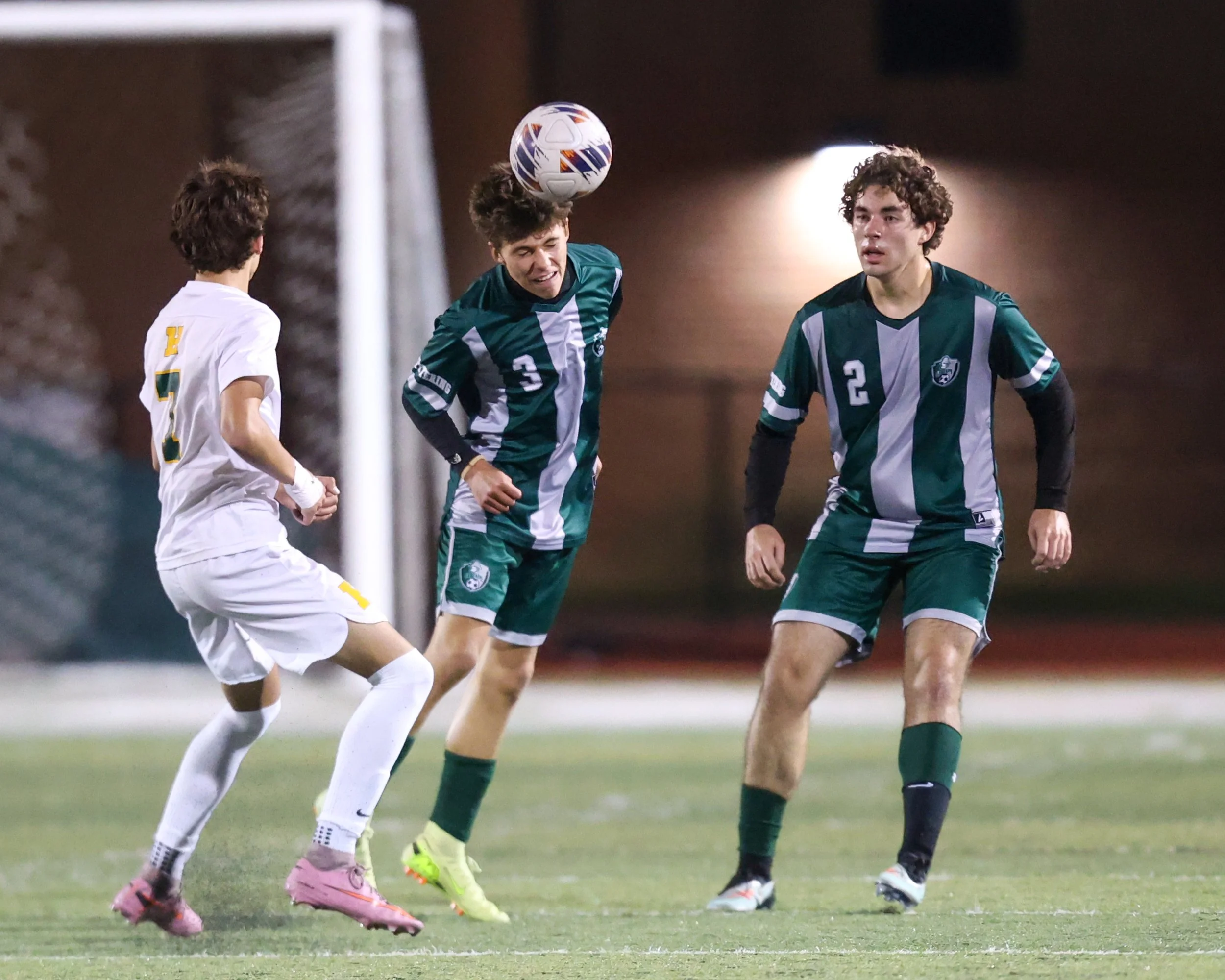 WK #3 heads the ball
