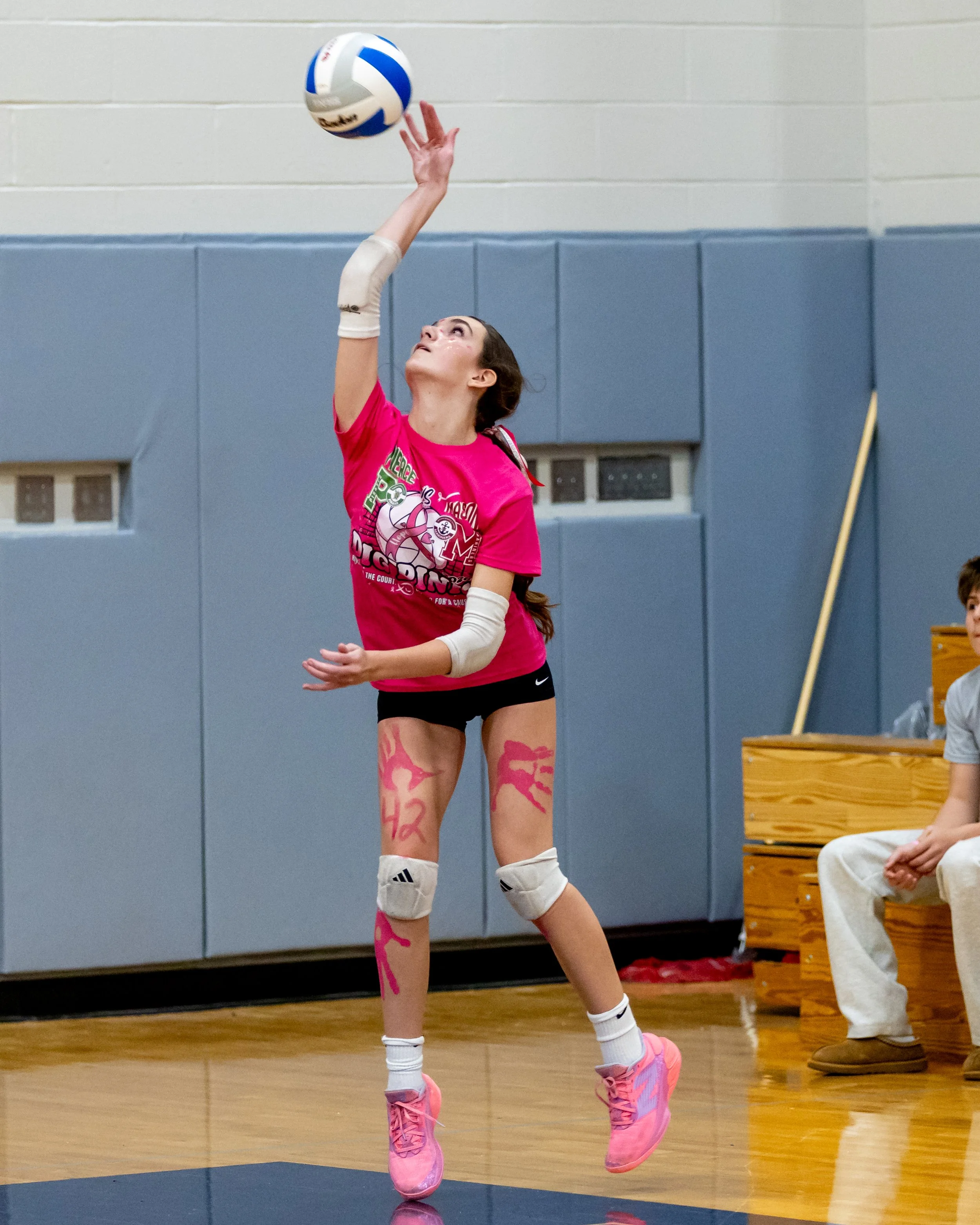Pierce player serves the ball