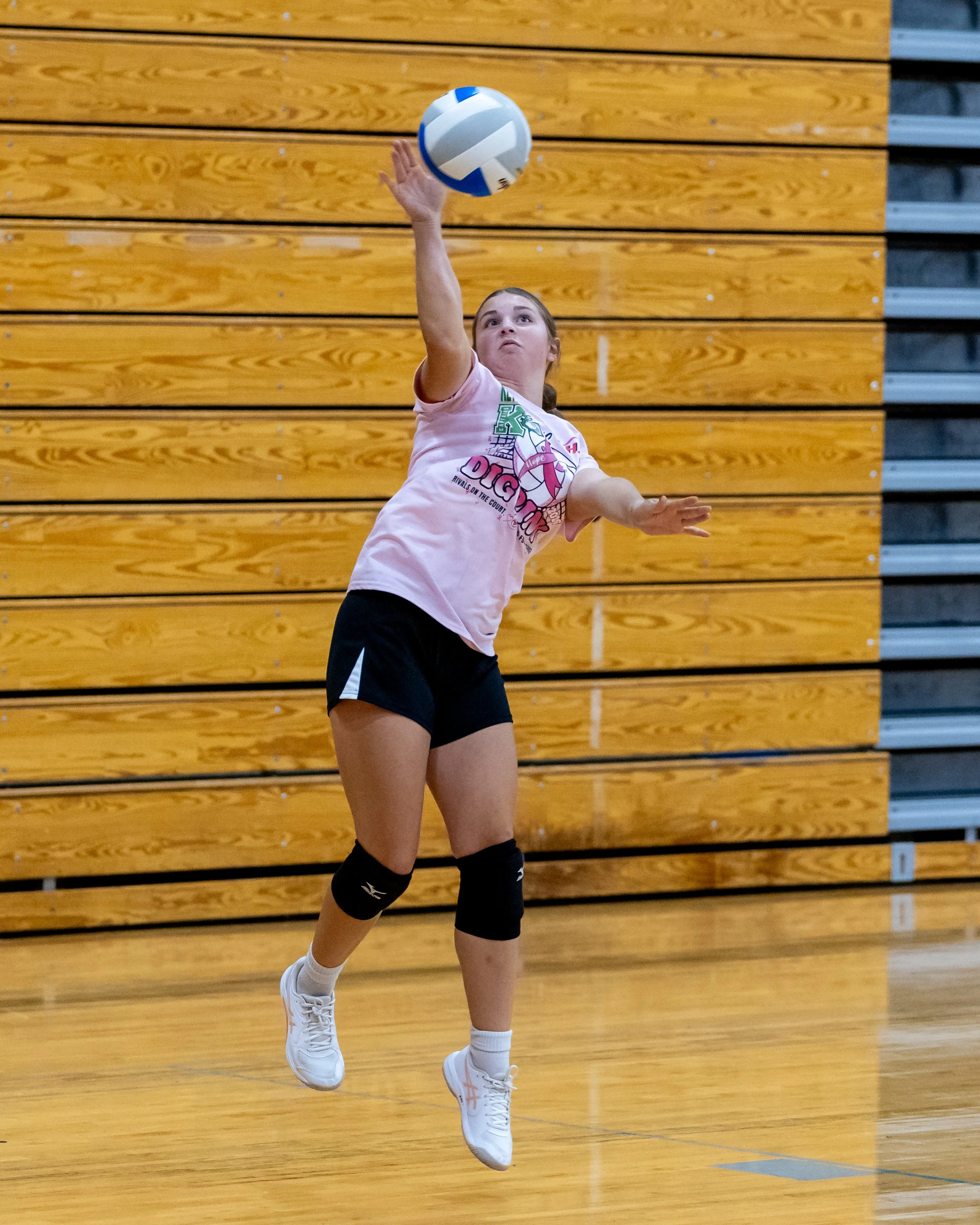 Firebird player serves the ball