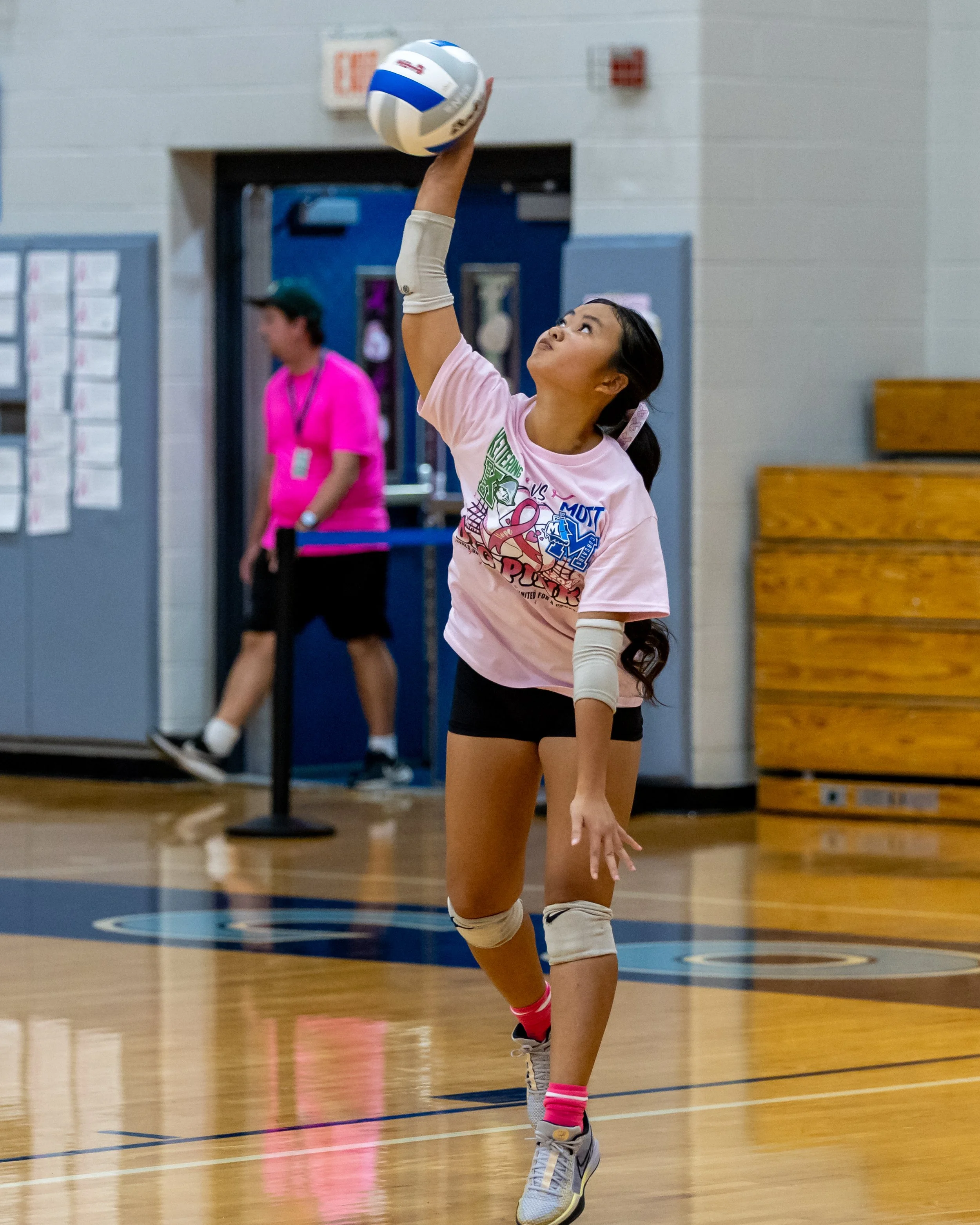 Mott player serves the ball