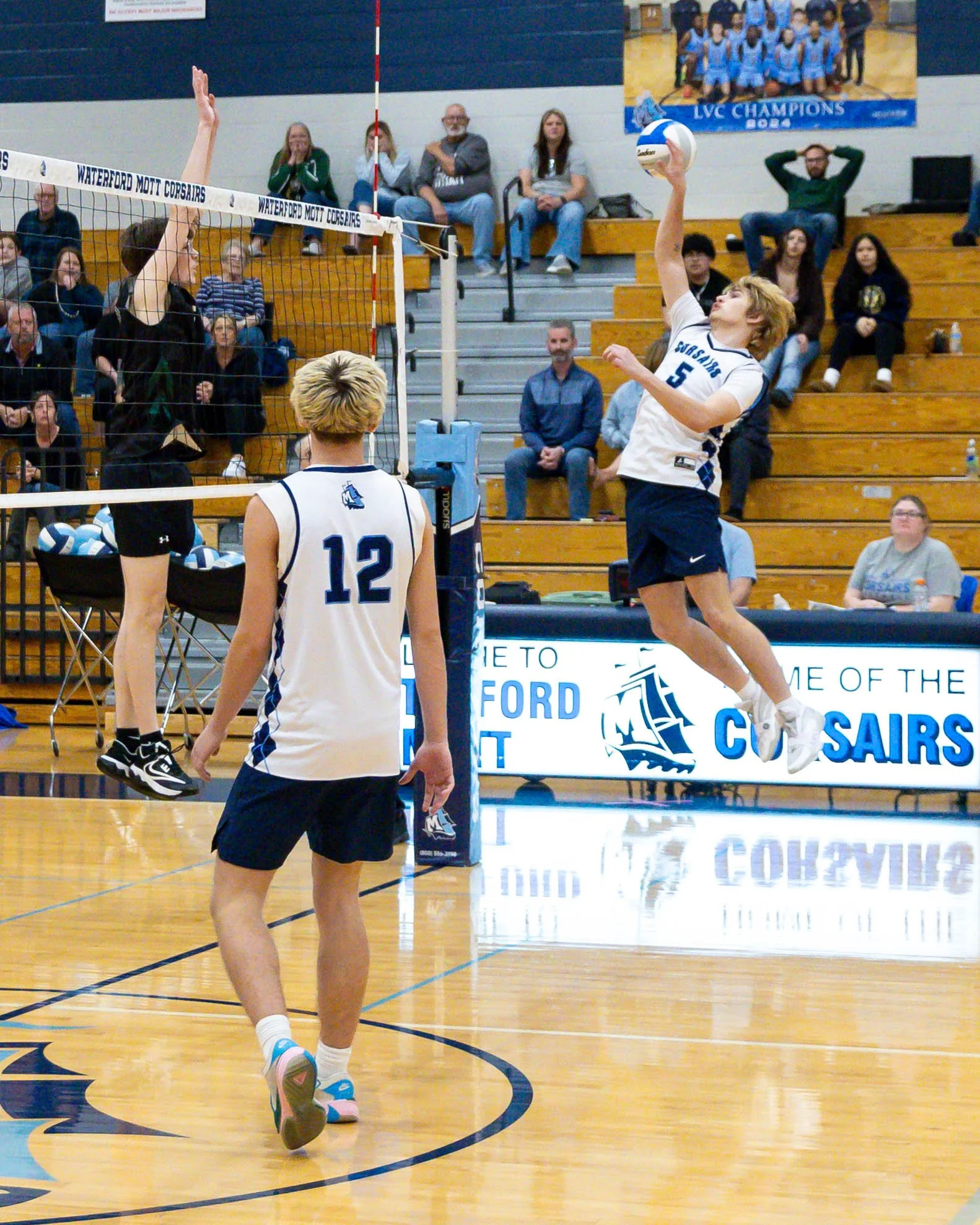 Mott #5 spikes the ball 