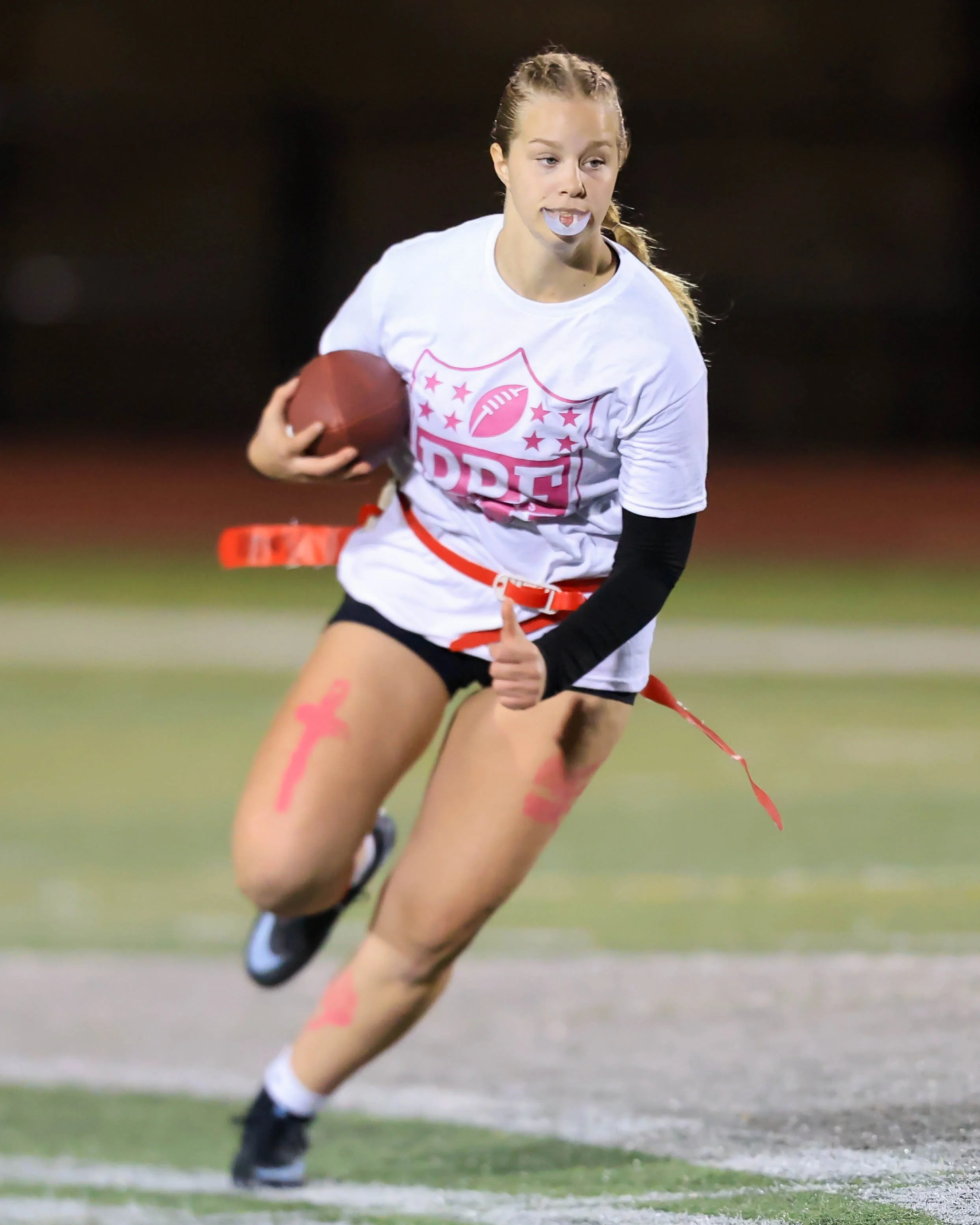 Junior quarterback runs with the ball