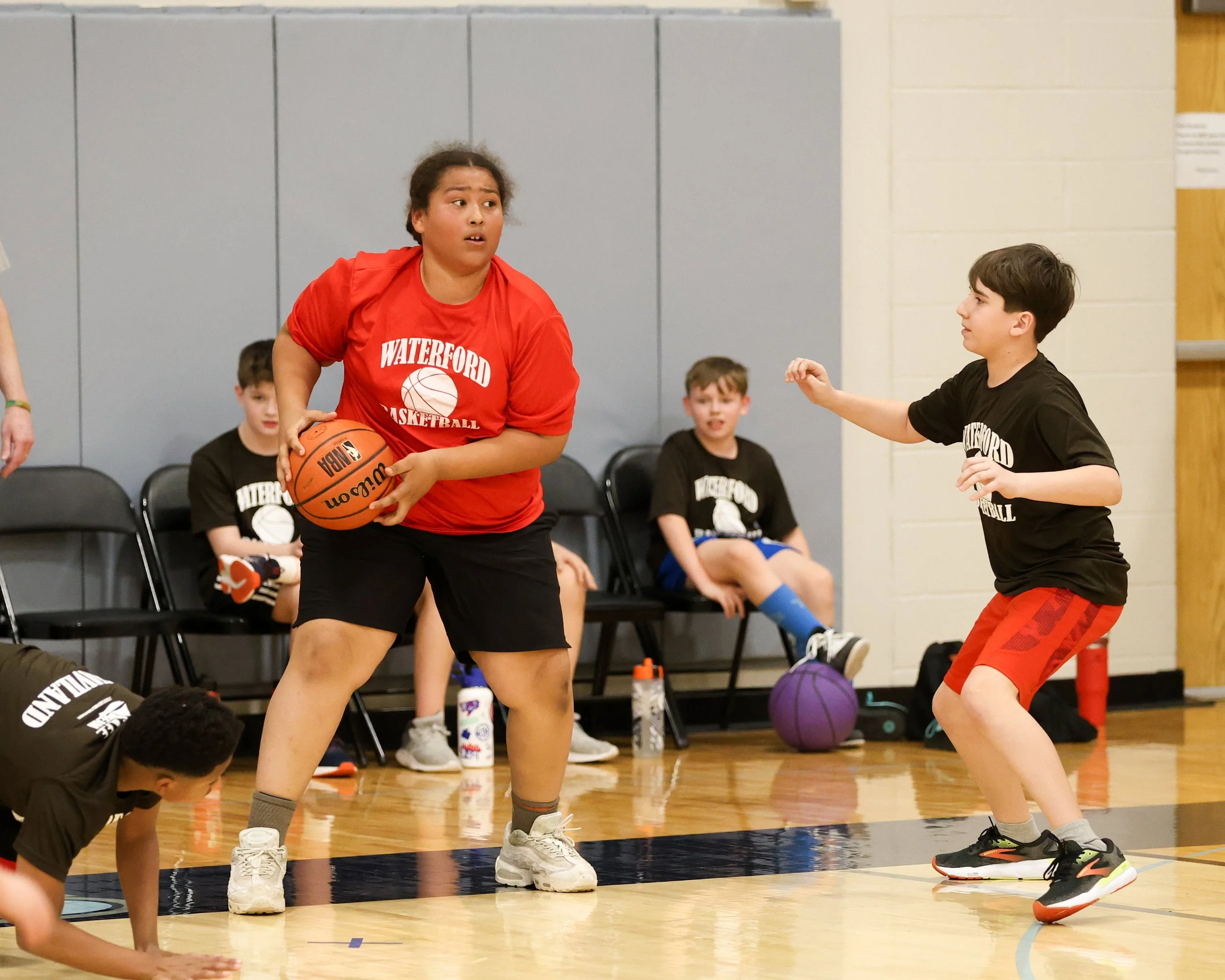 Houghton boy holds the ball guarded by Haviland boy