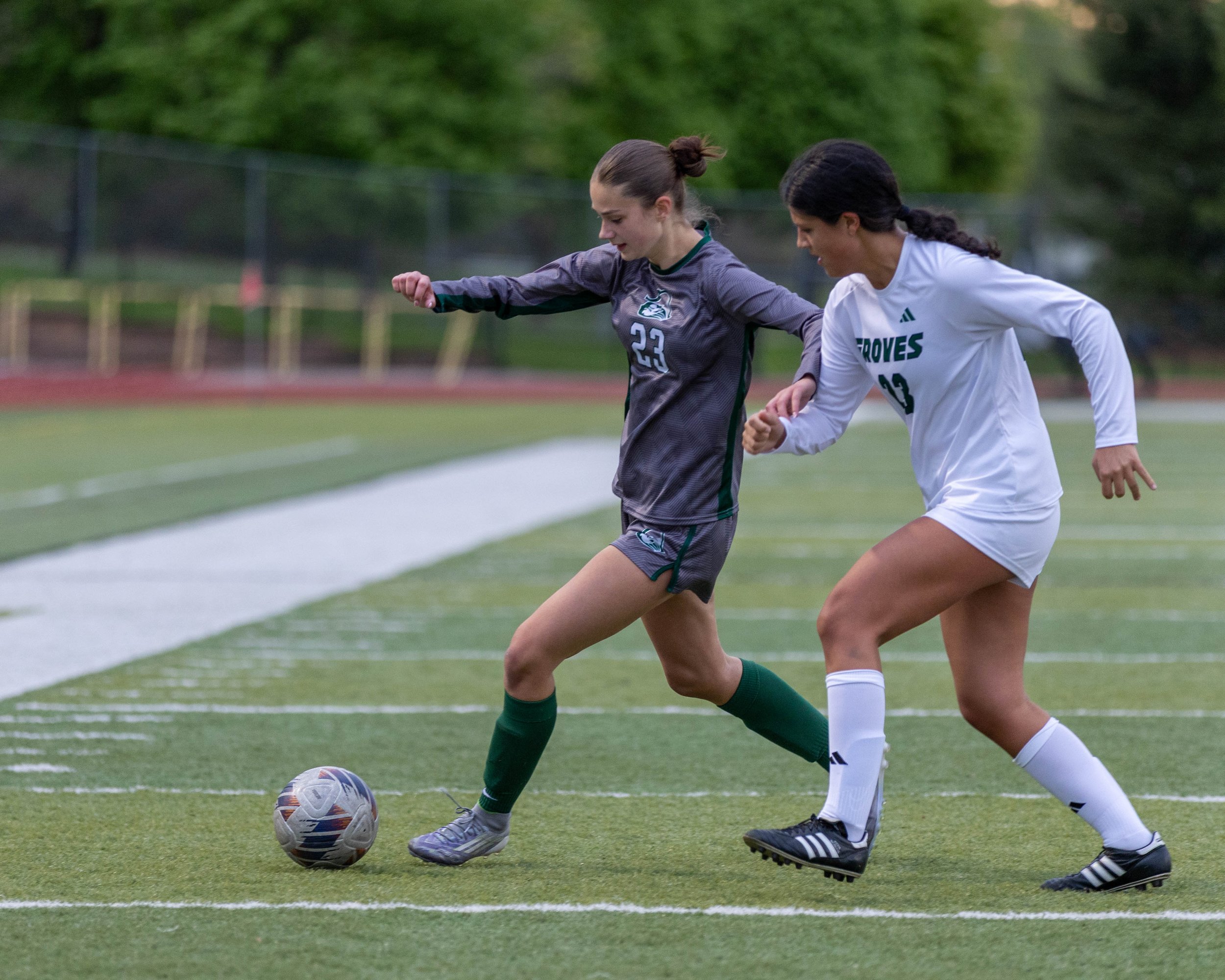 #23 fights for the ball