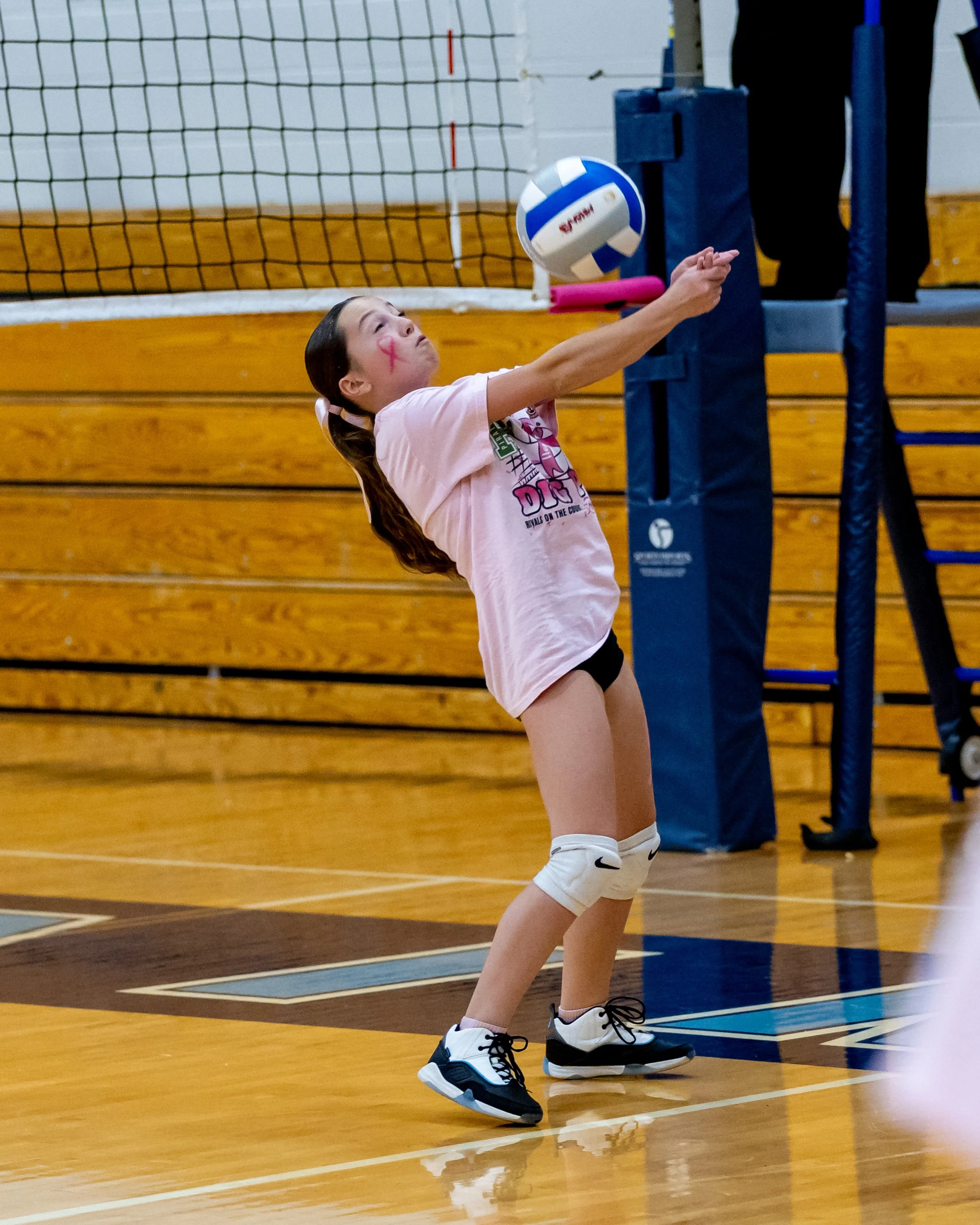 Mason player hits the ball