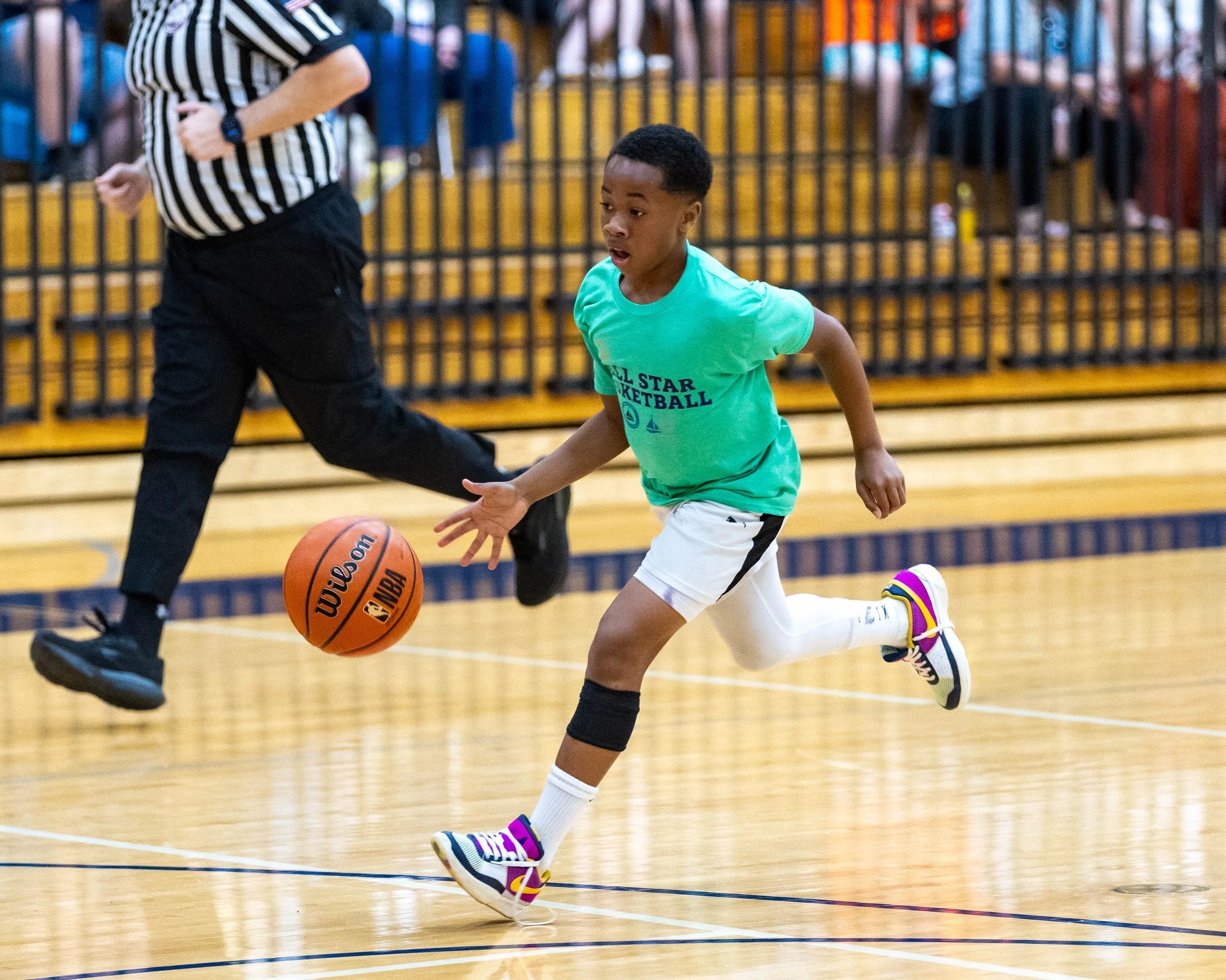 South boy dribbles the ball