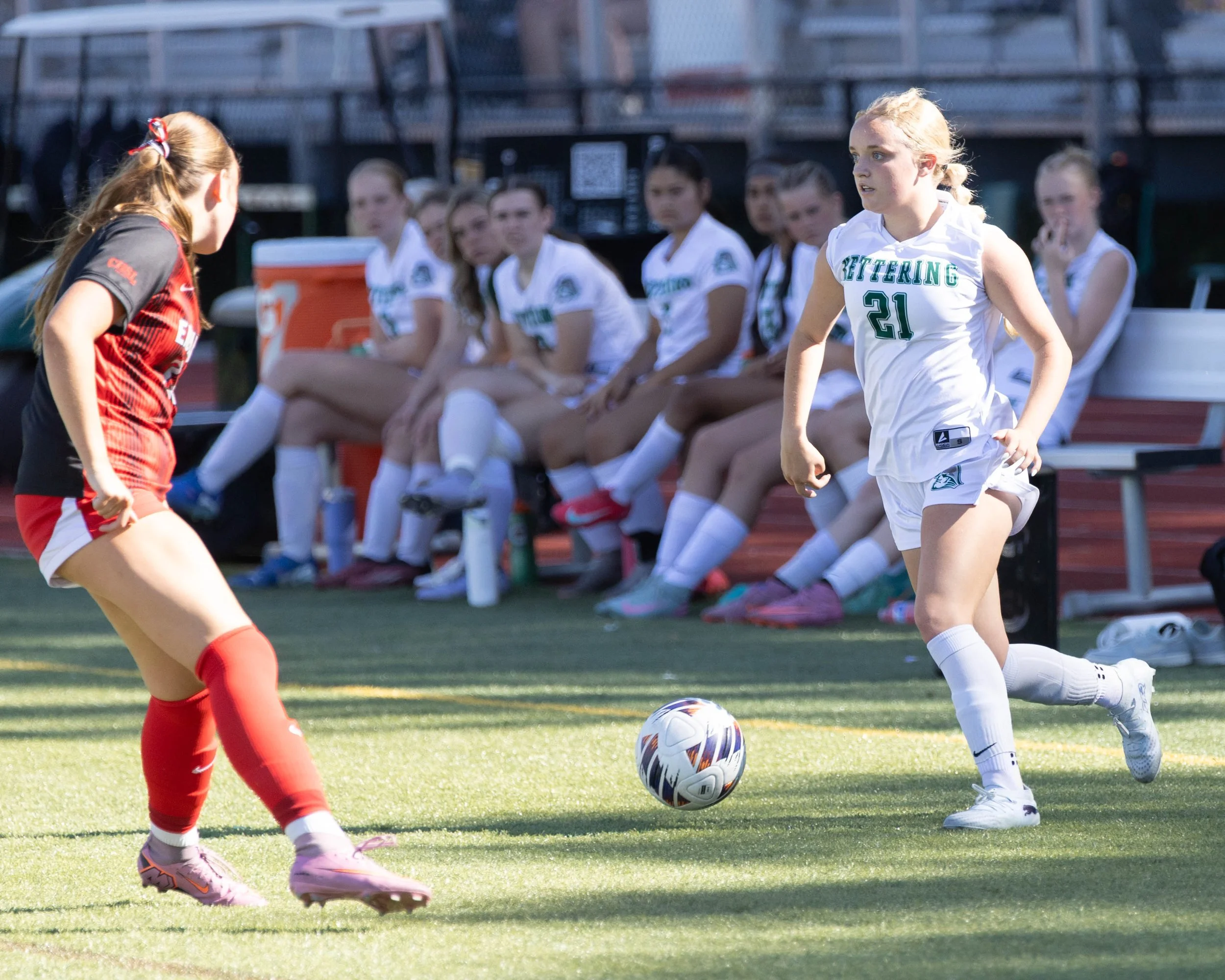 #21 with the ball with an opponent