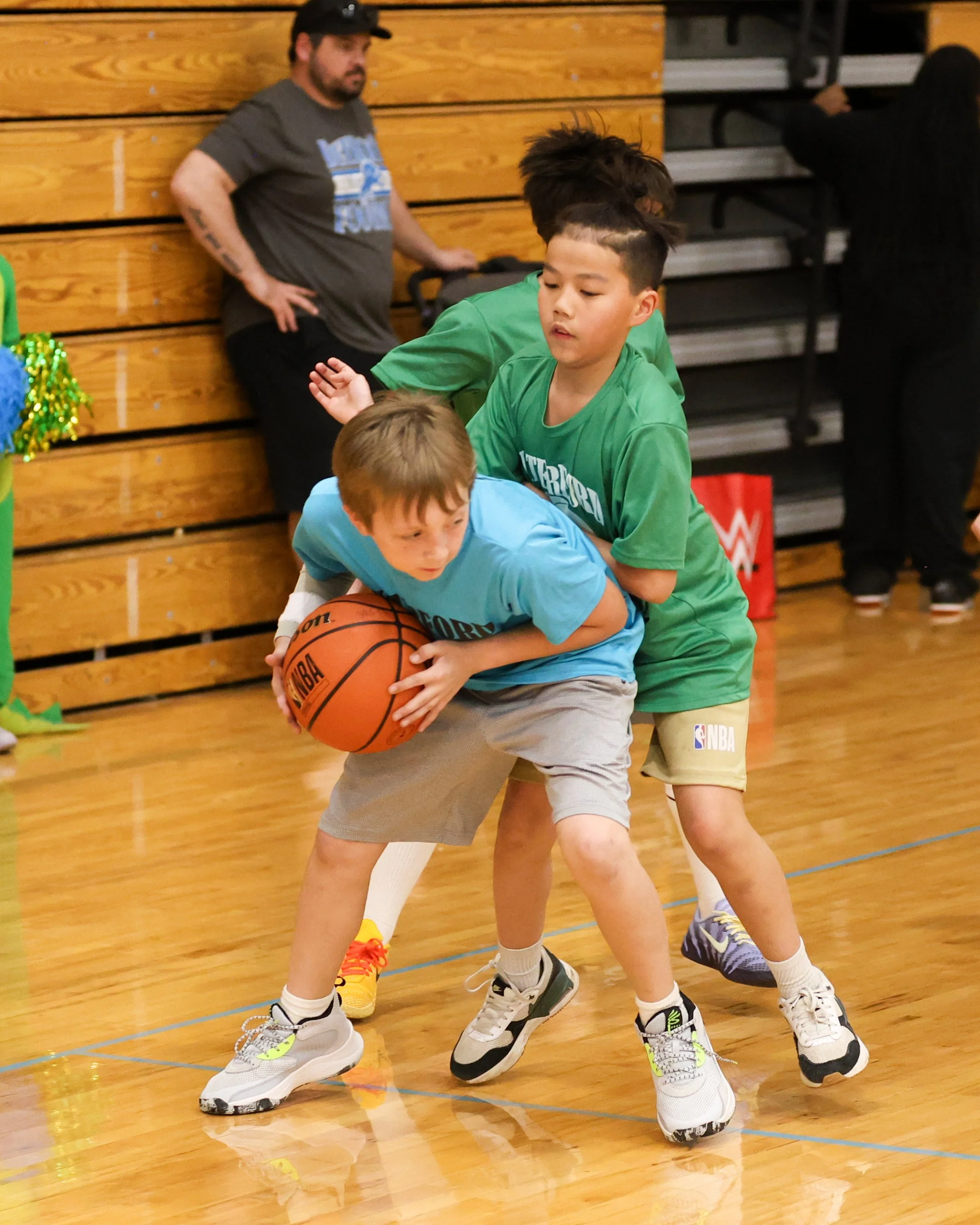 Cooley boy holds the ball guarded by Grayson boy