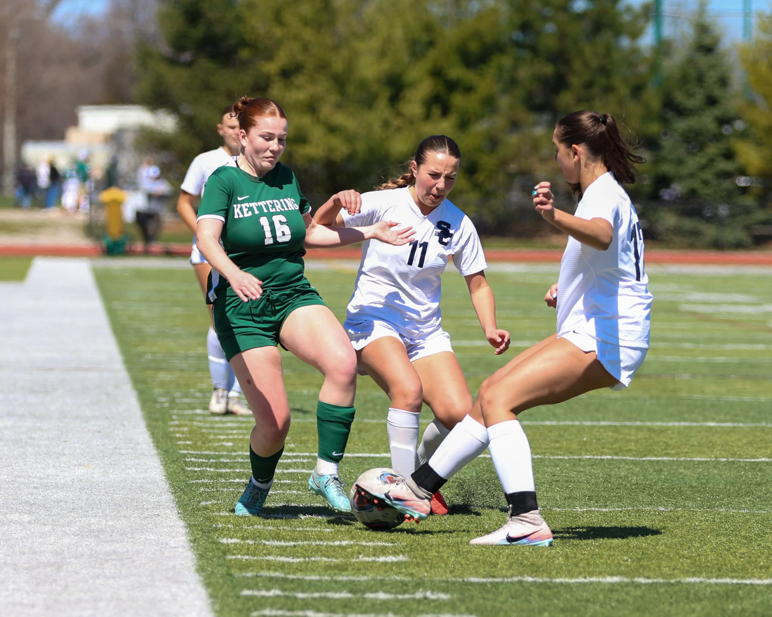 #16 battles for the ball
