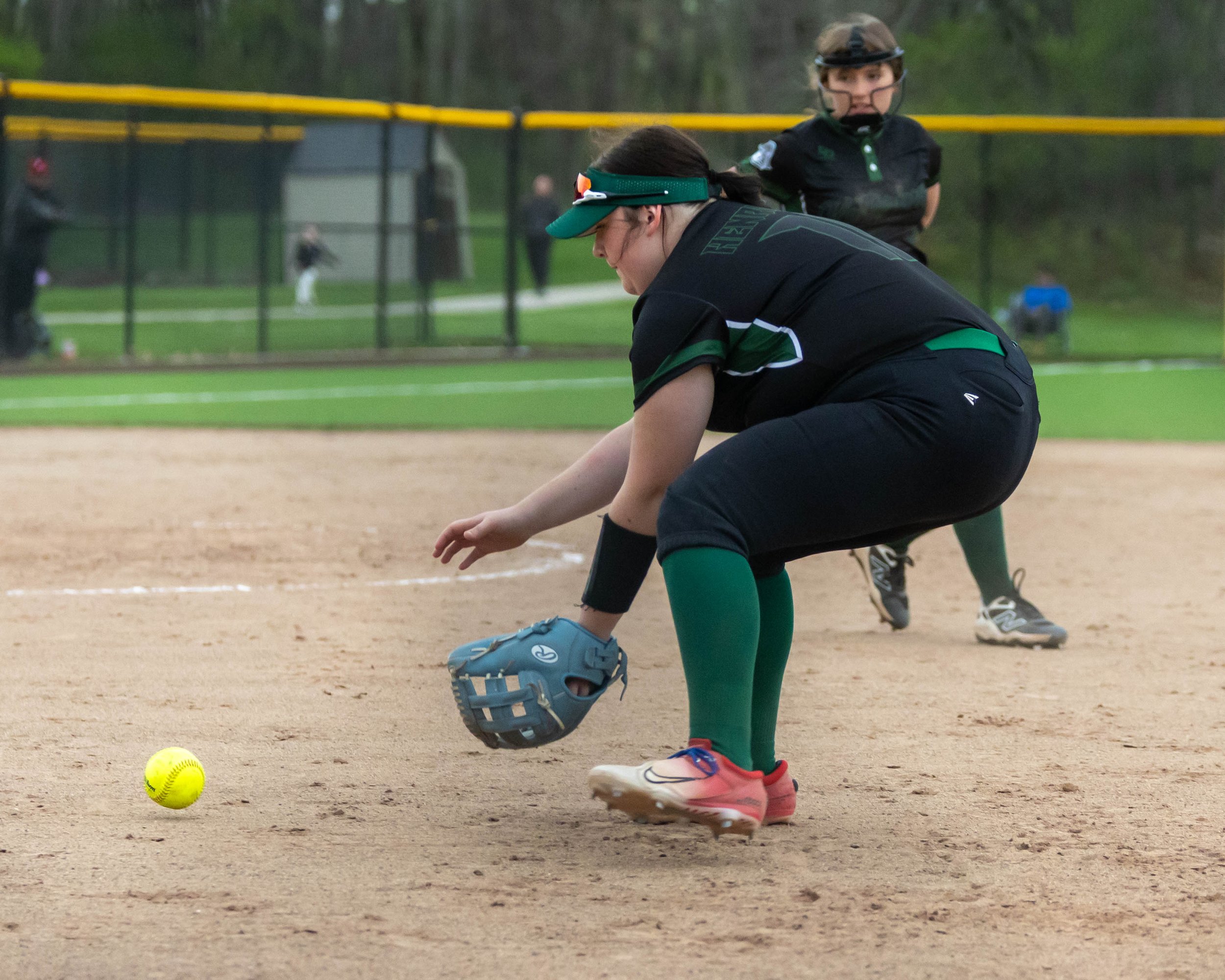 Kettering first base waits for the ball